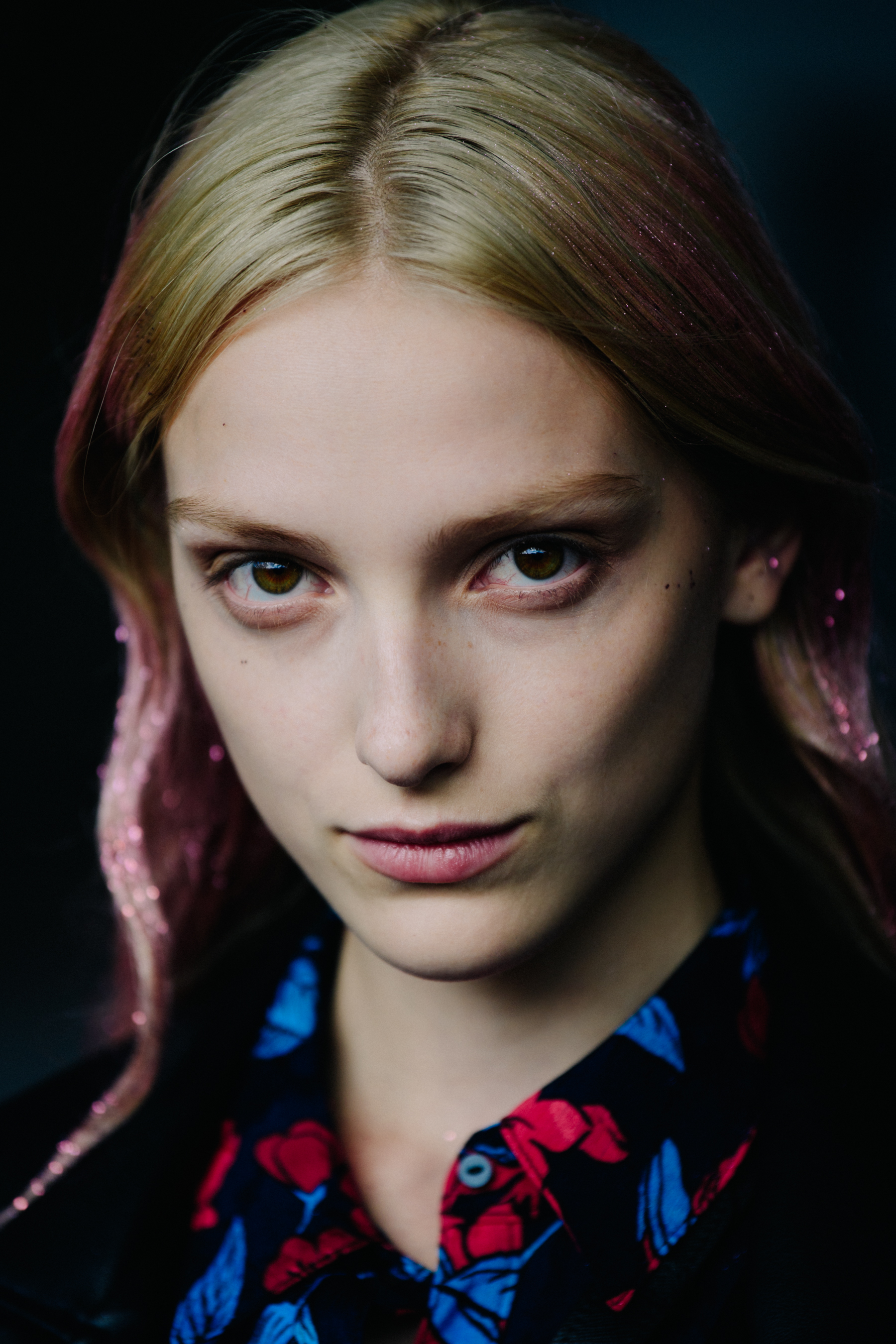 Portrait of model with pink glitter hair