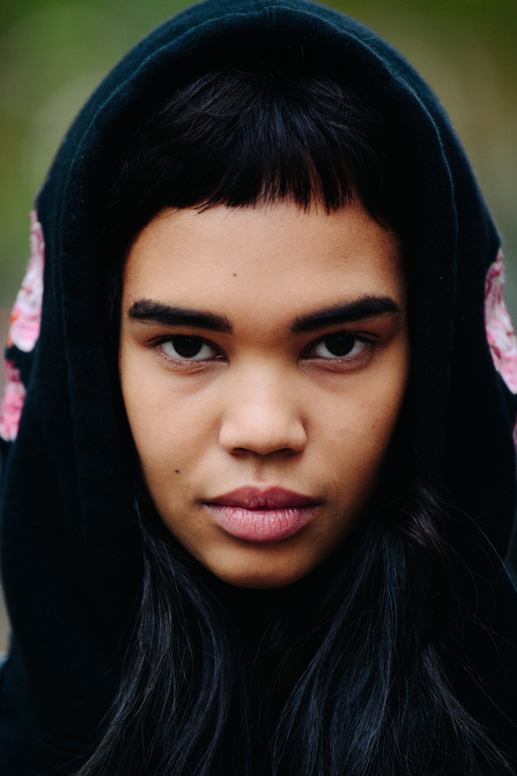 Portrait of model wearing black hoody