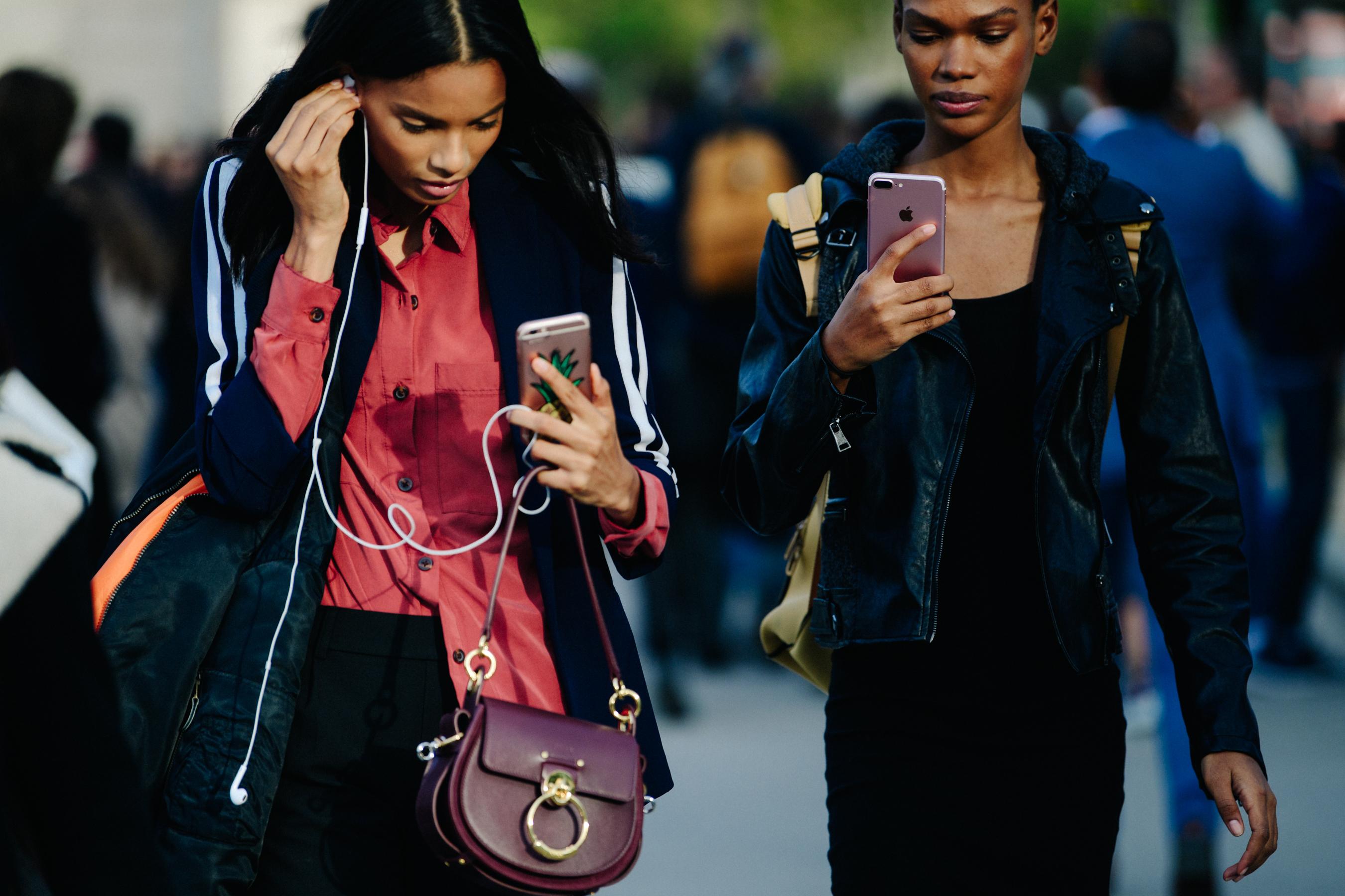 Two models wearing black jackets