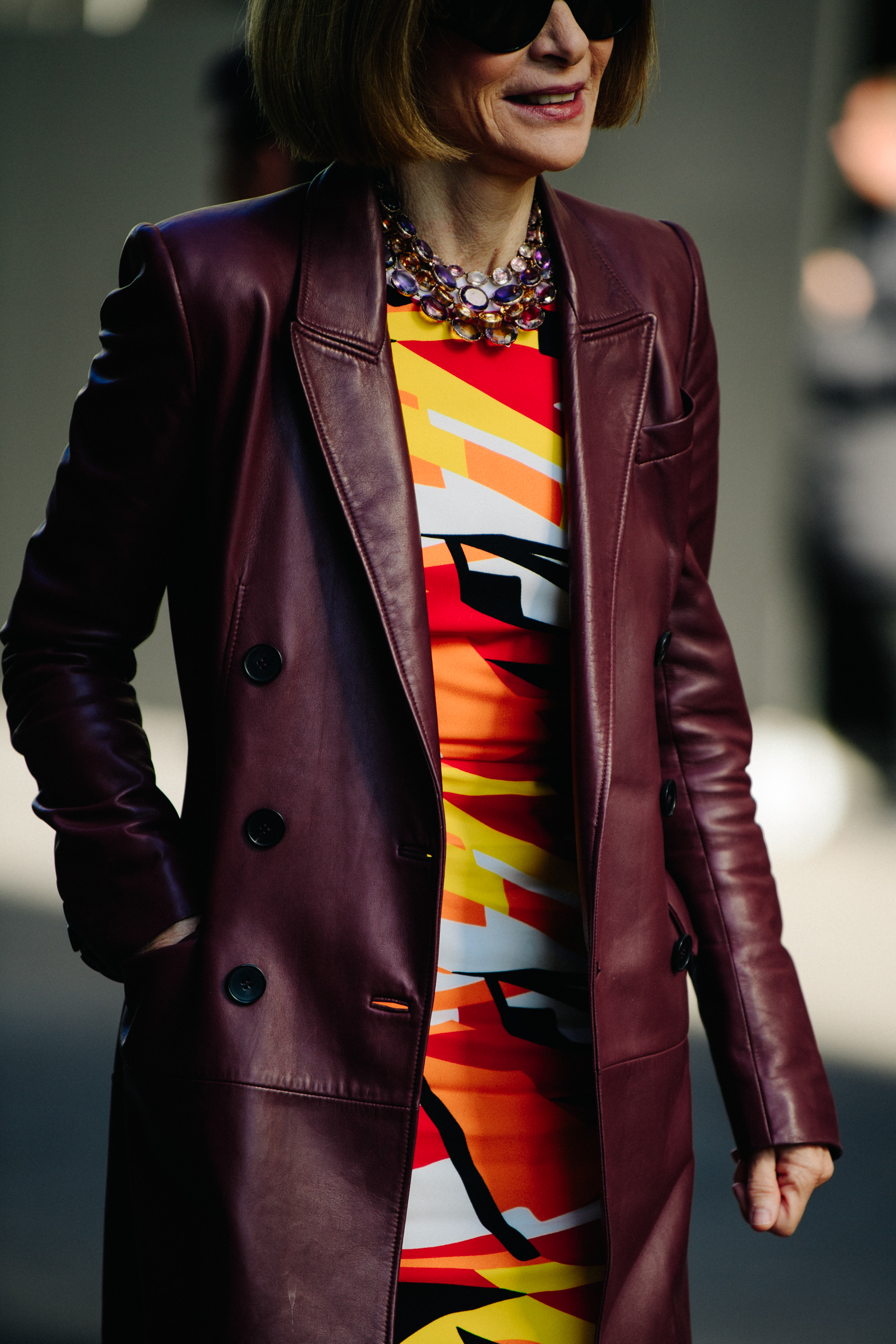 Editor wearing red leather coat