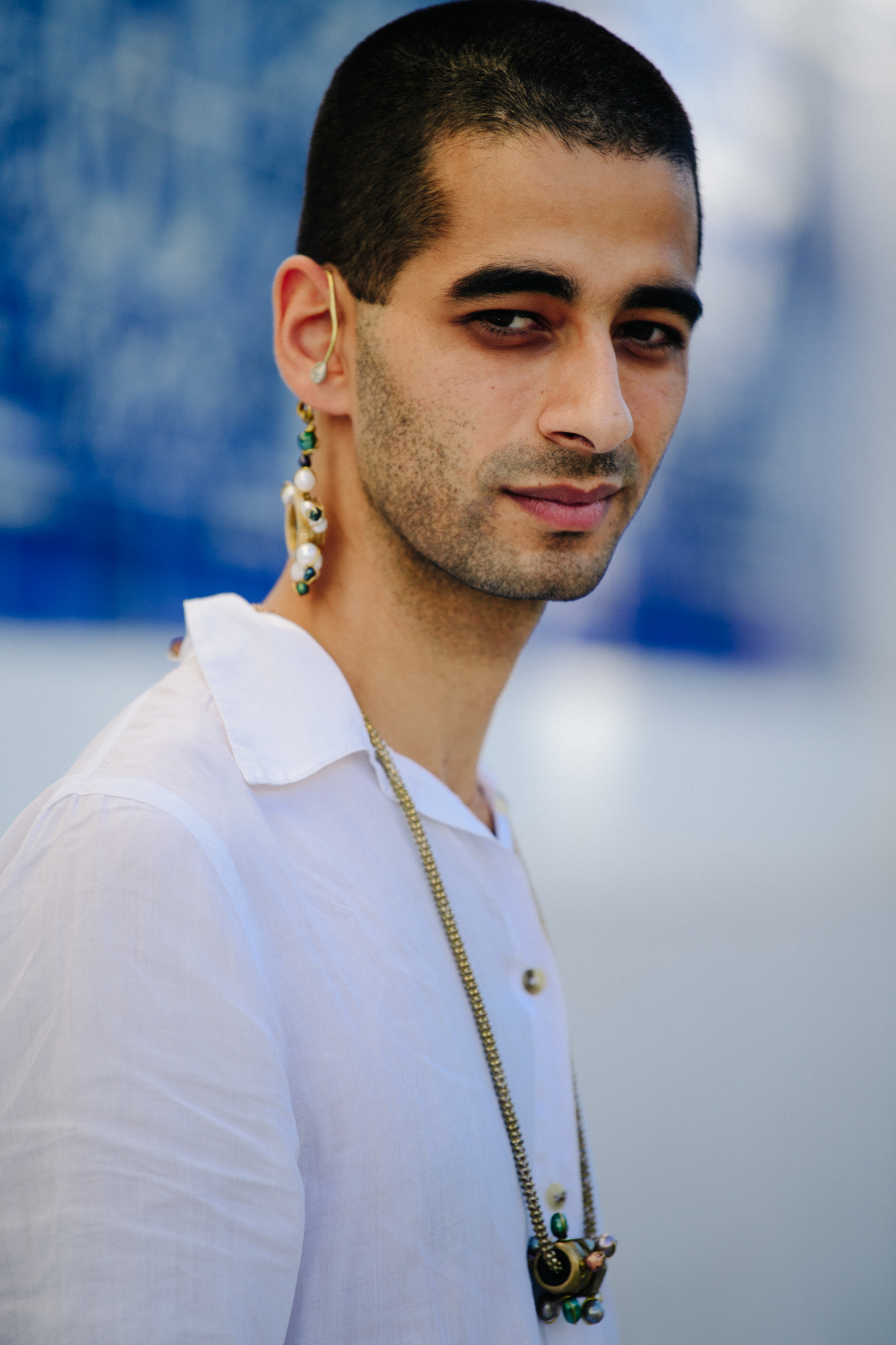 Man wearing long white shirt