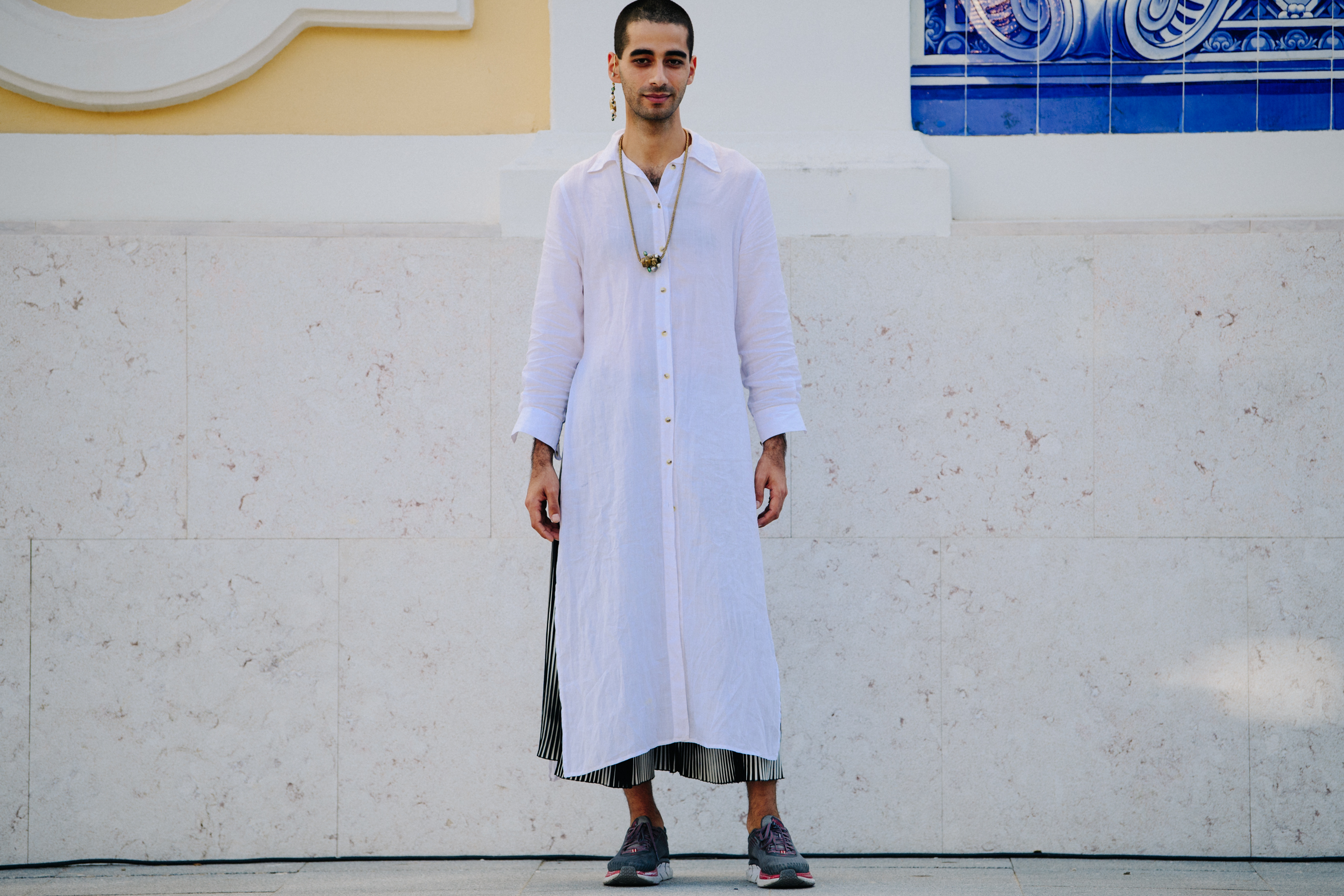 Man wearing long white shirt