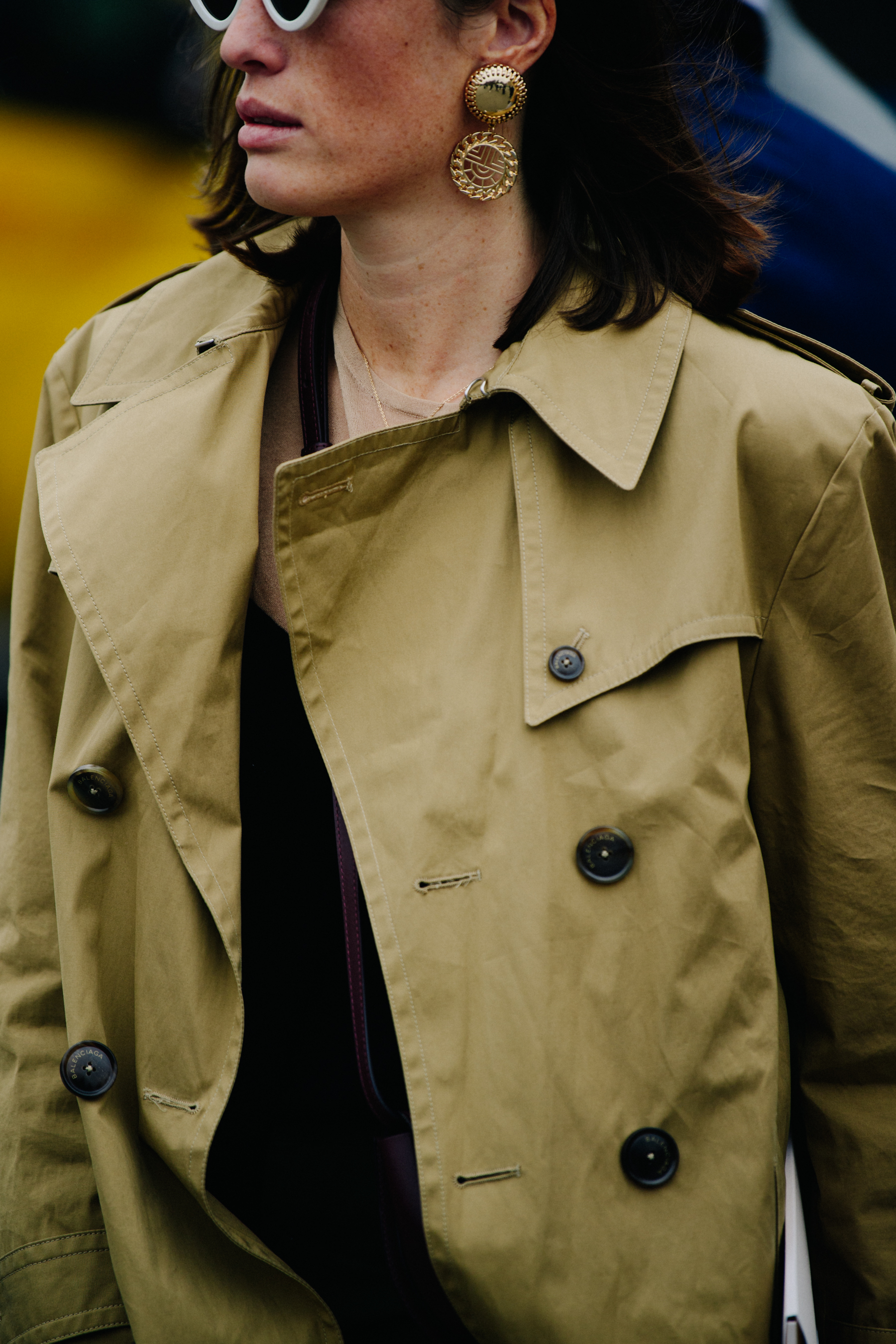 Woman wearing tan trench coat