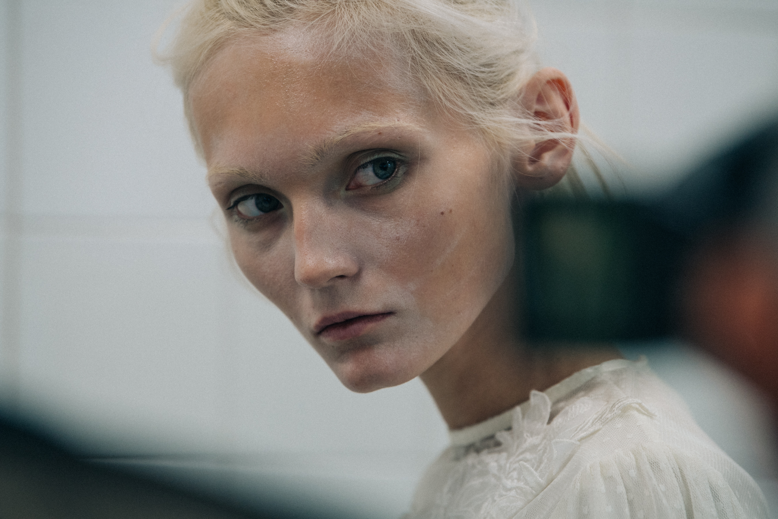 Model wearing white outfit at VF Vandevorst