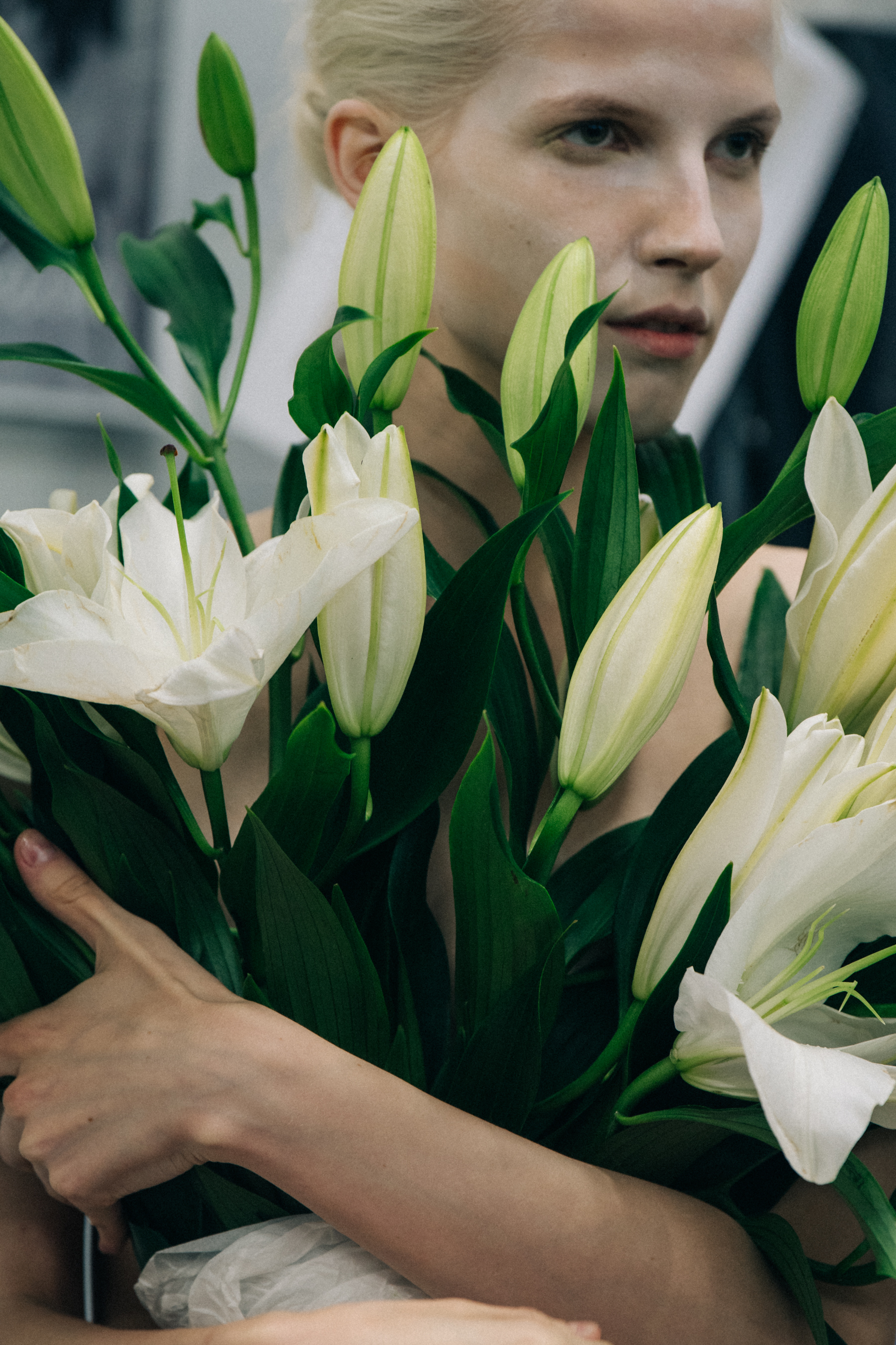 Model carrying flowers at VF Vandevorst