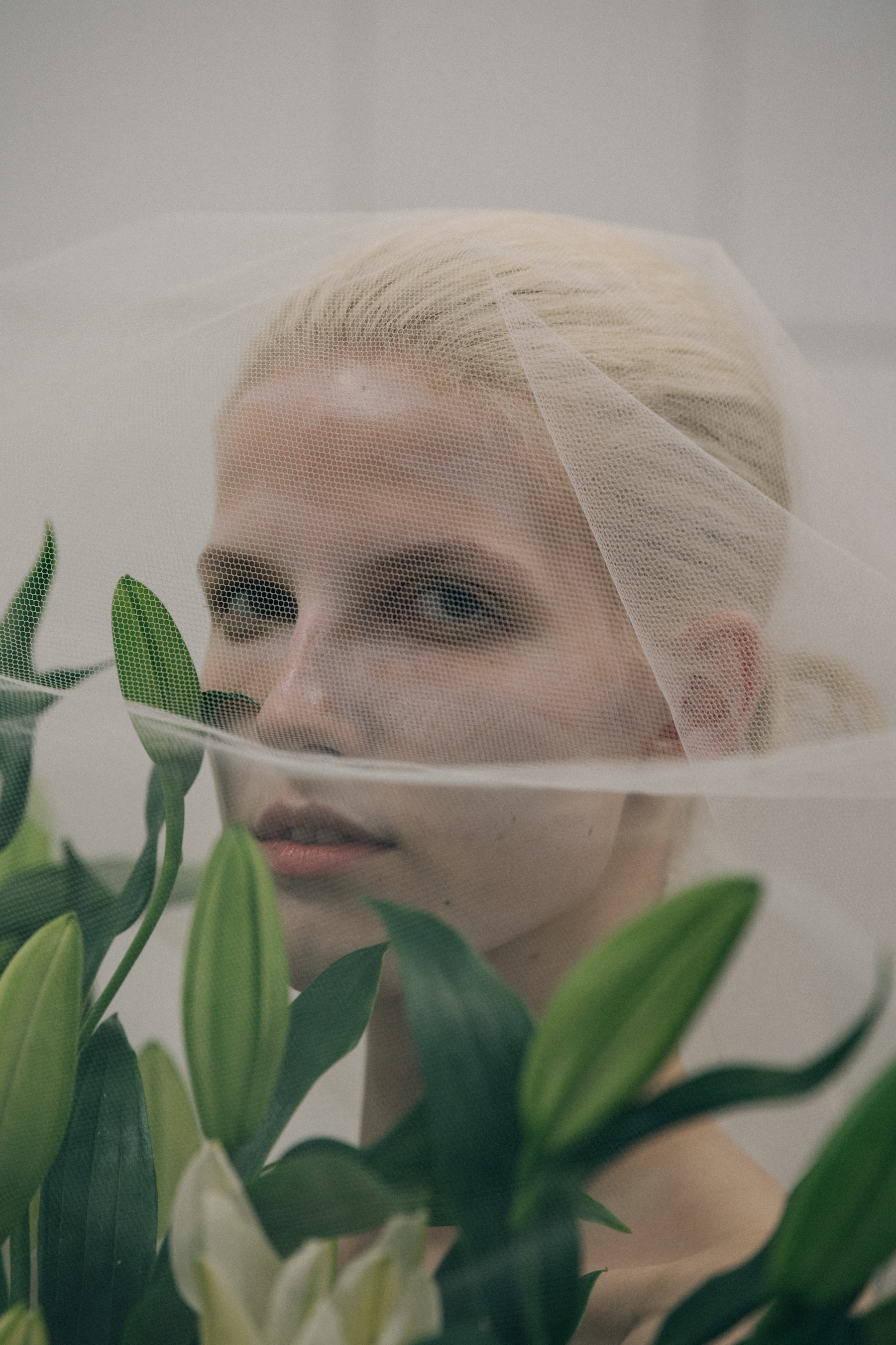 Model carrying flowers at VF Vandevorst