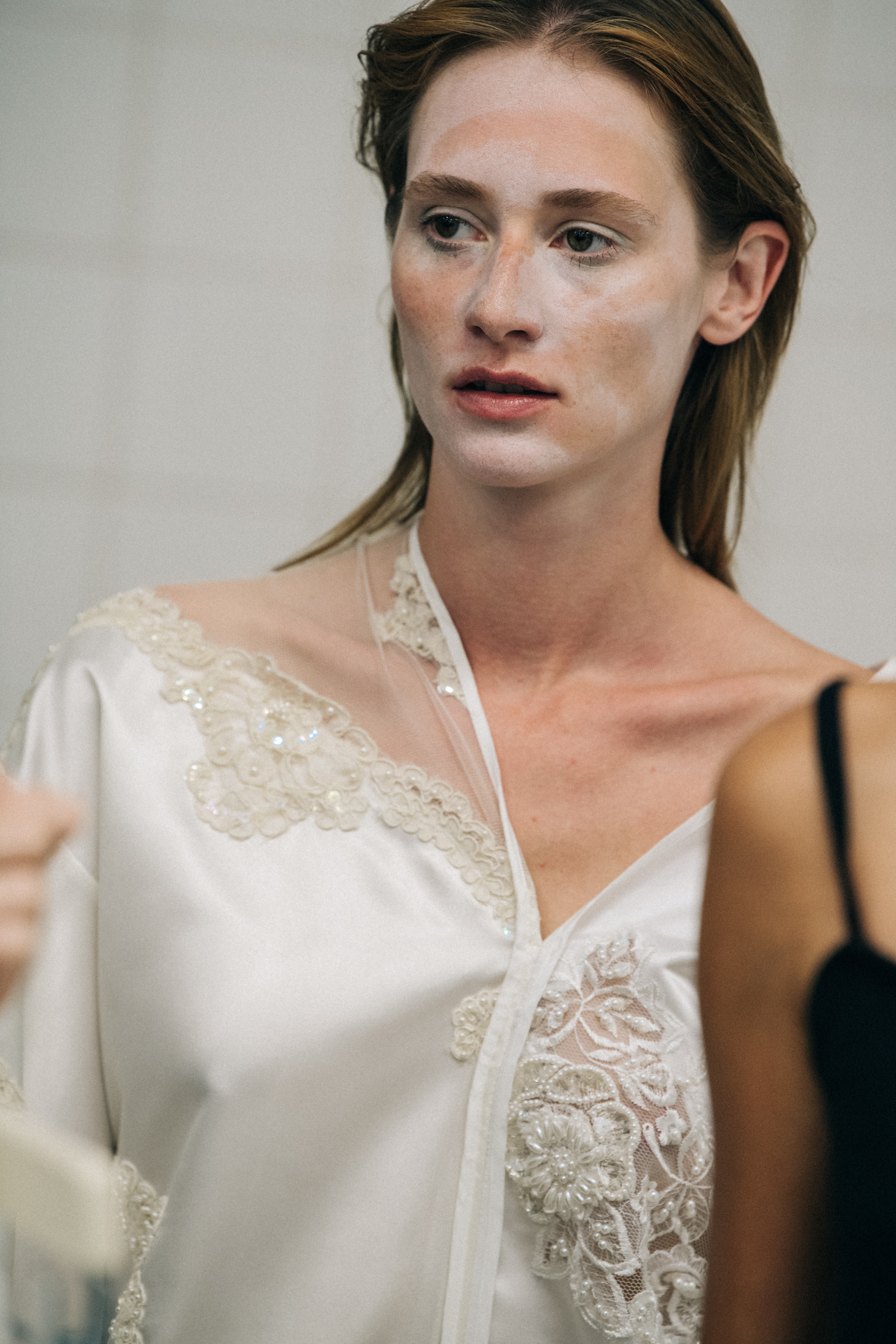 Model wearing white outfit at VF Vandevorst