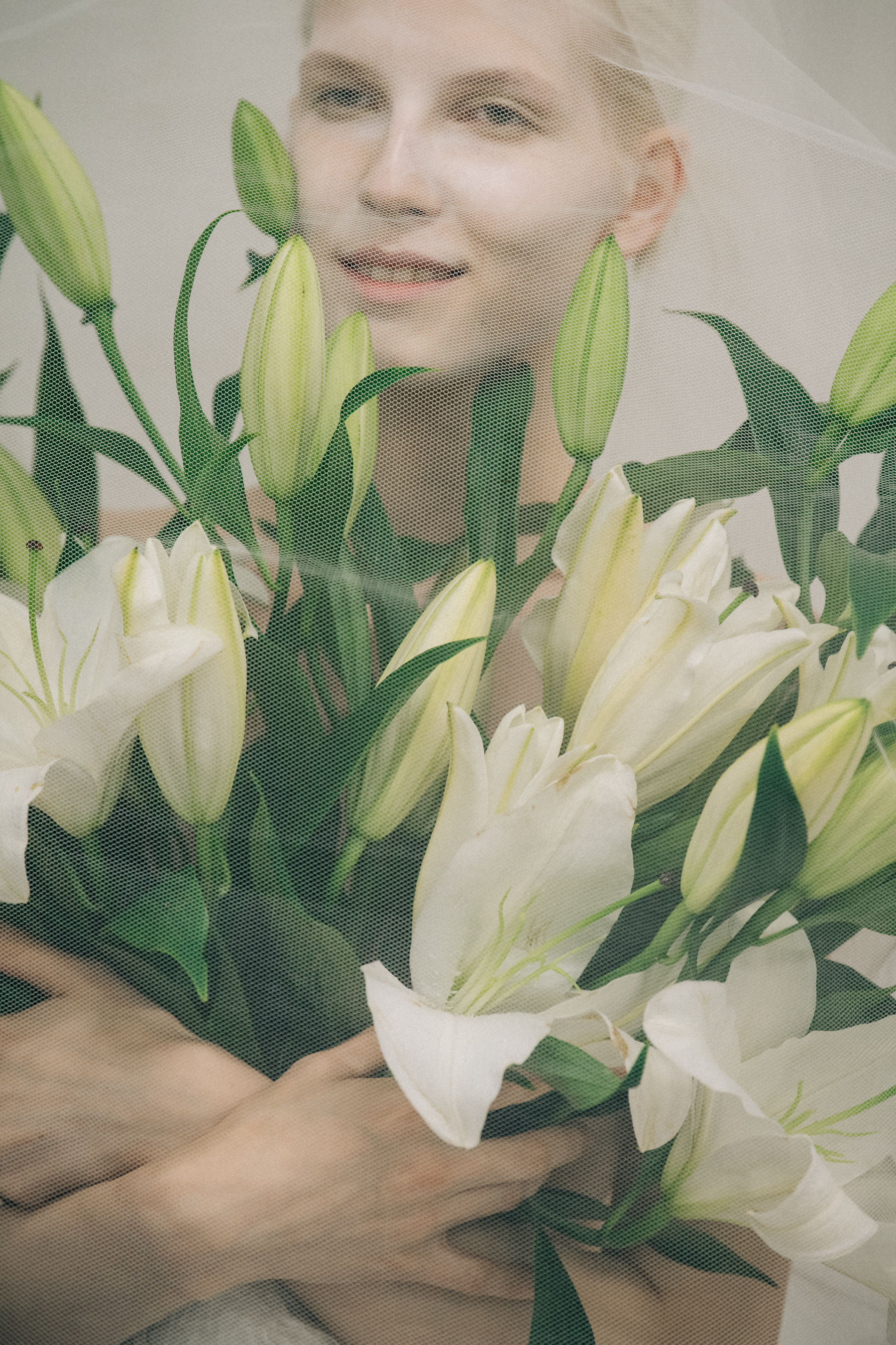 Model carrying flowers at VF Vandevorst