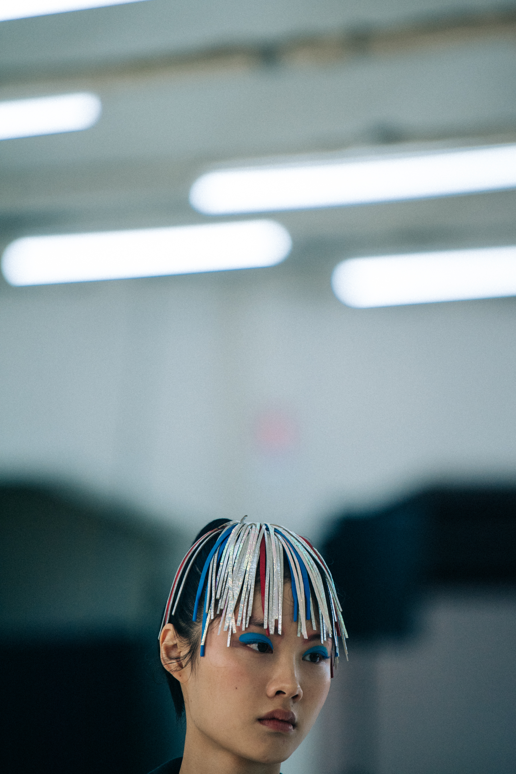 Models wearing colourful eyeliner