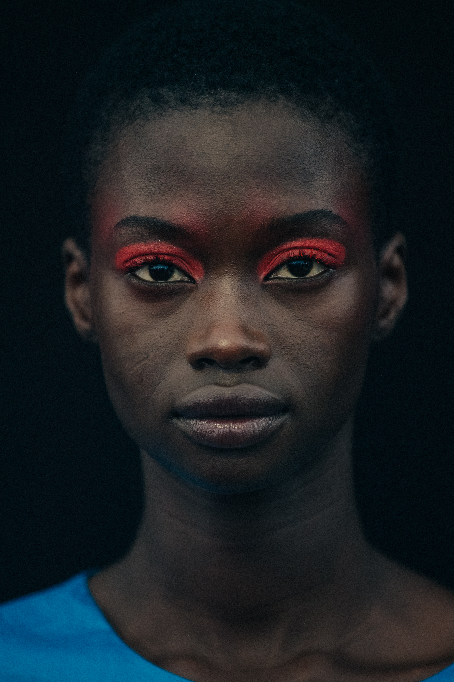 Portrait of model wearing colourful eyeliner