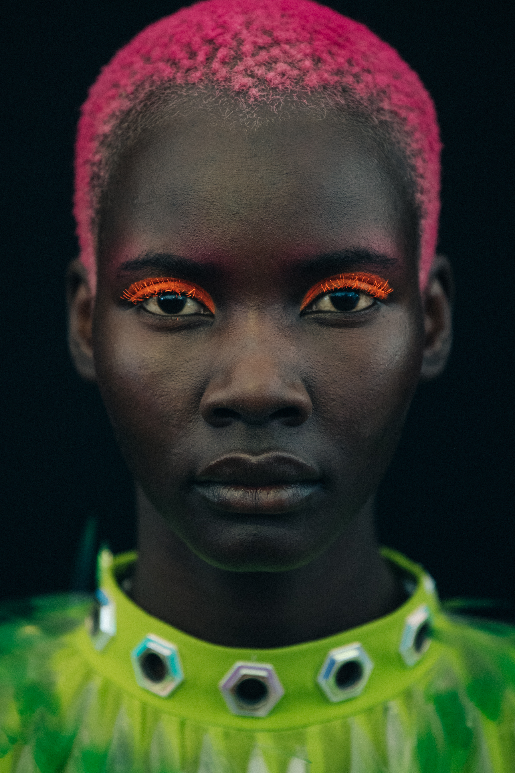 Portrait of model wearing colourful eyeliner