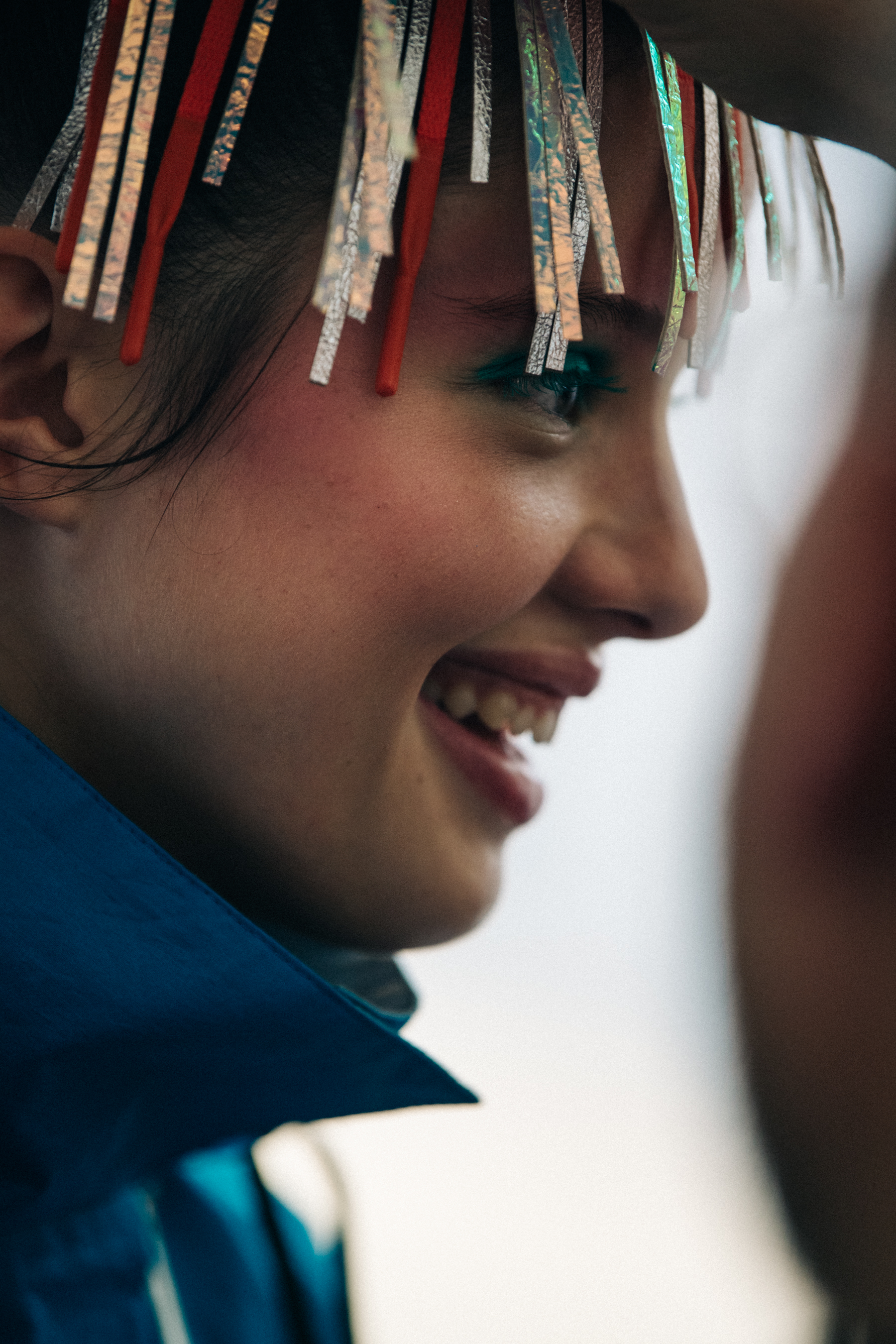 Model wearing colourful headpiece