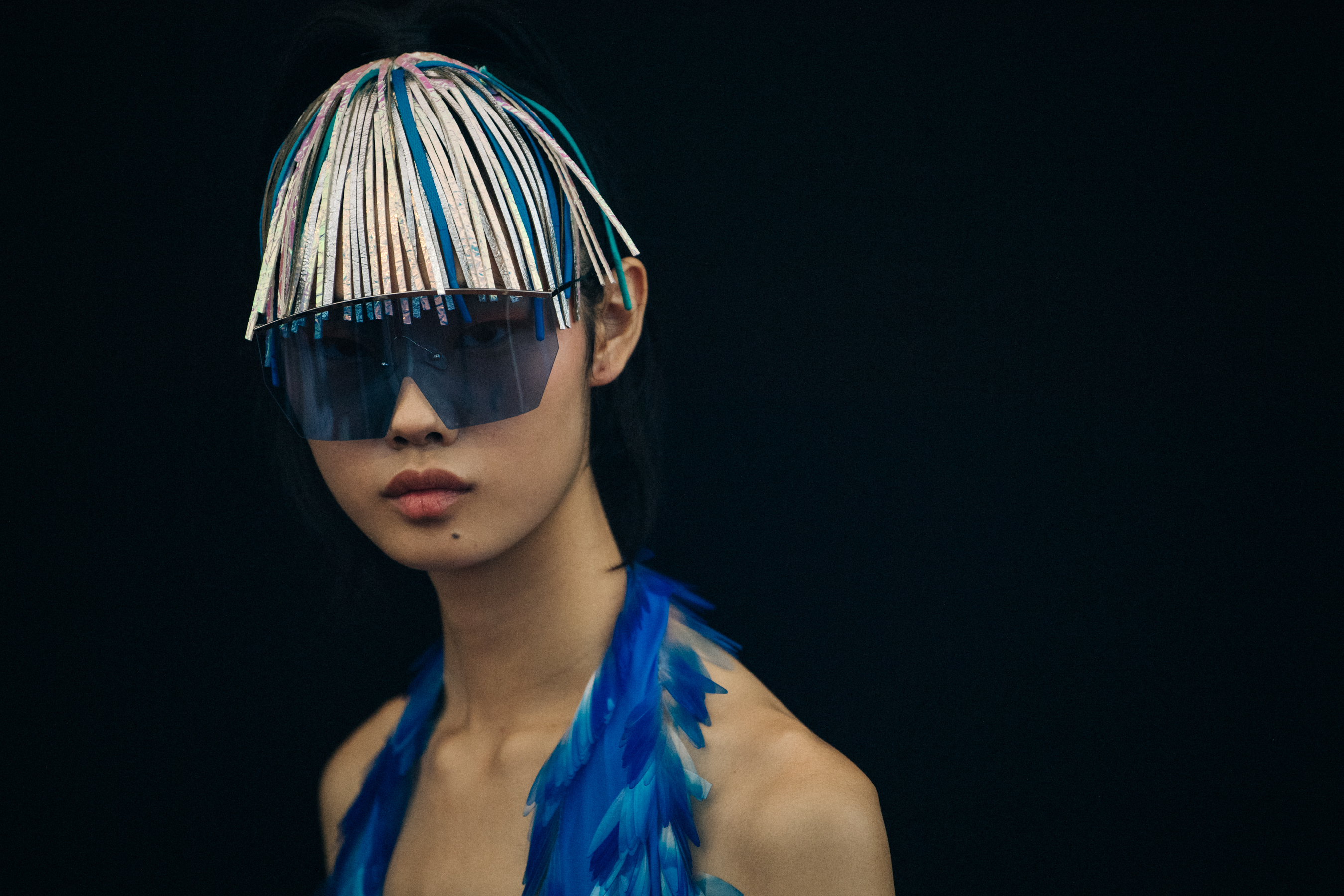 Model wearing large Byblos sunglasses