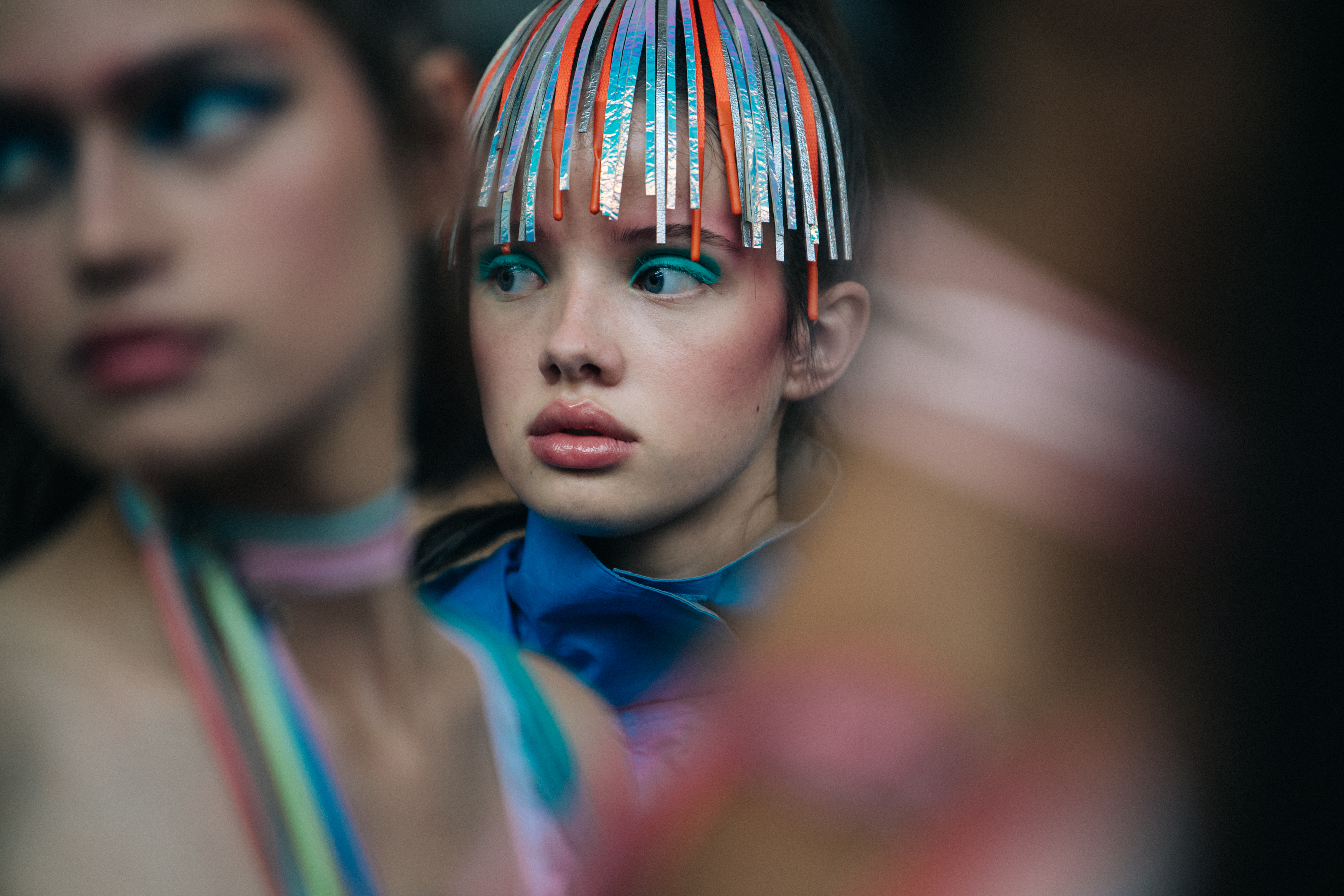 Models wearing colourful eyeliner