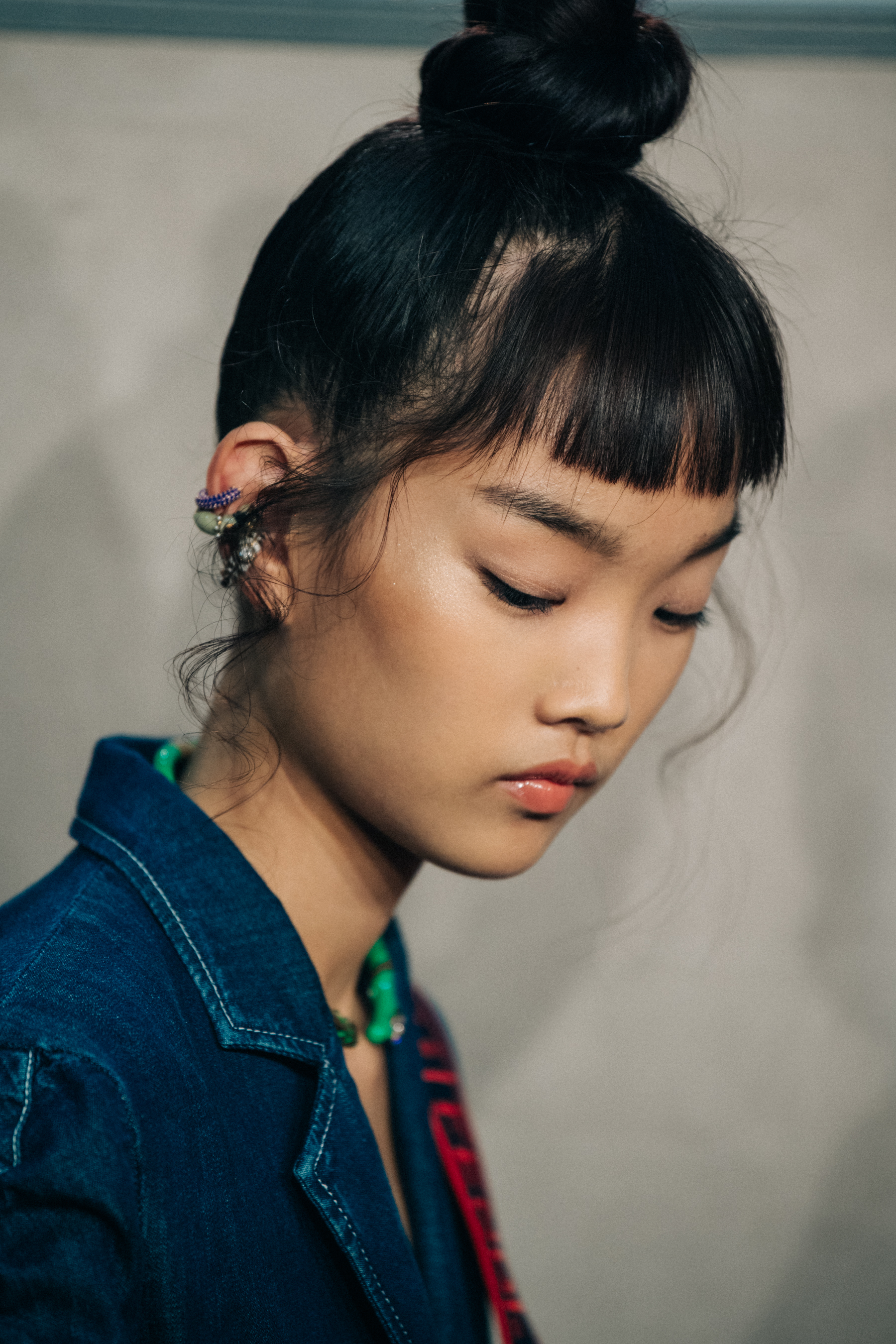 Model with hair tied up at Fendi