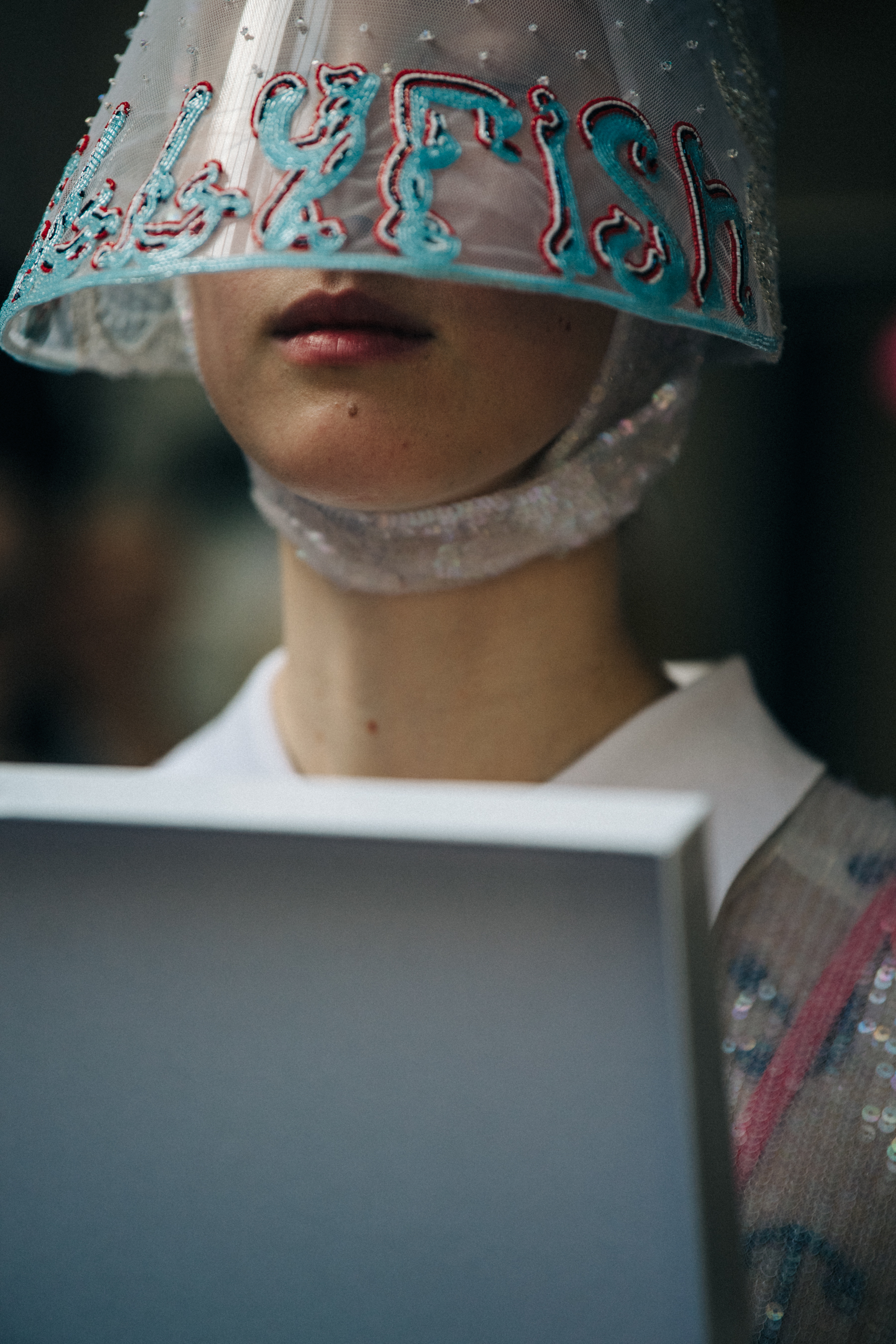 Model wearing Thom Browne hat