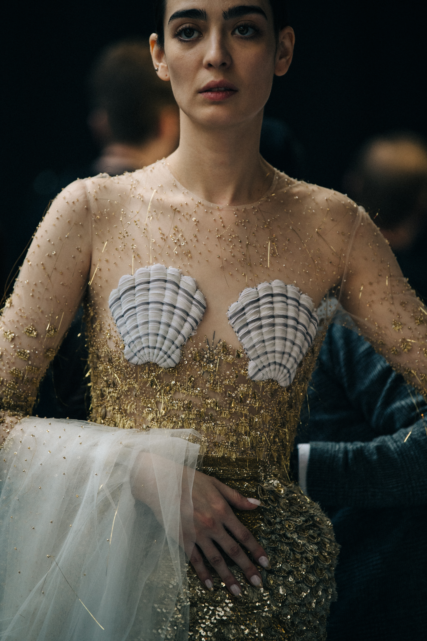 Model wearing sequin Thom Browne top