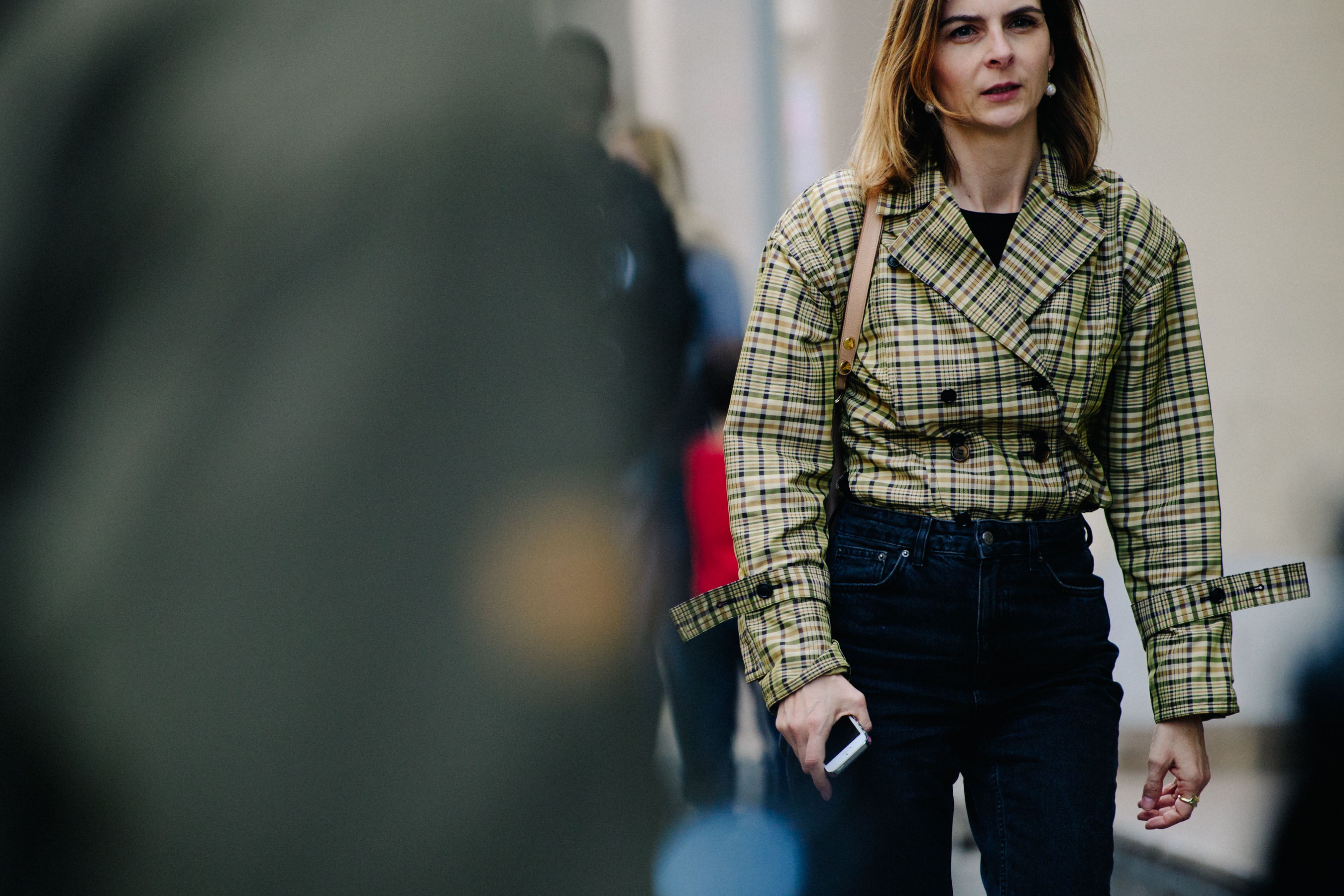 Woman wearing check coat