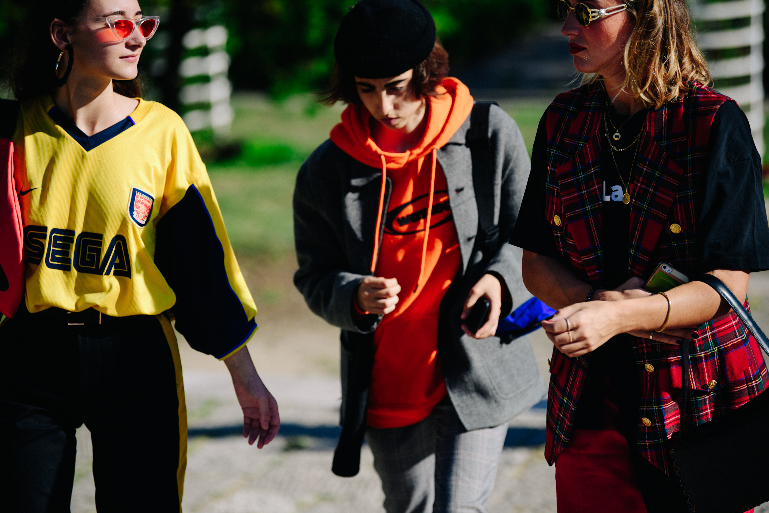 Three women wearing cool outfits