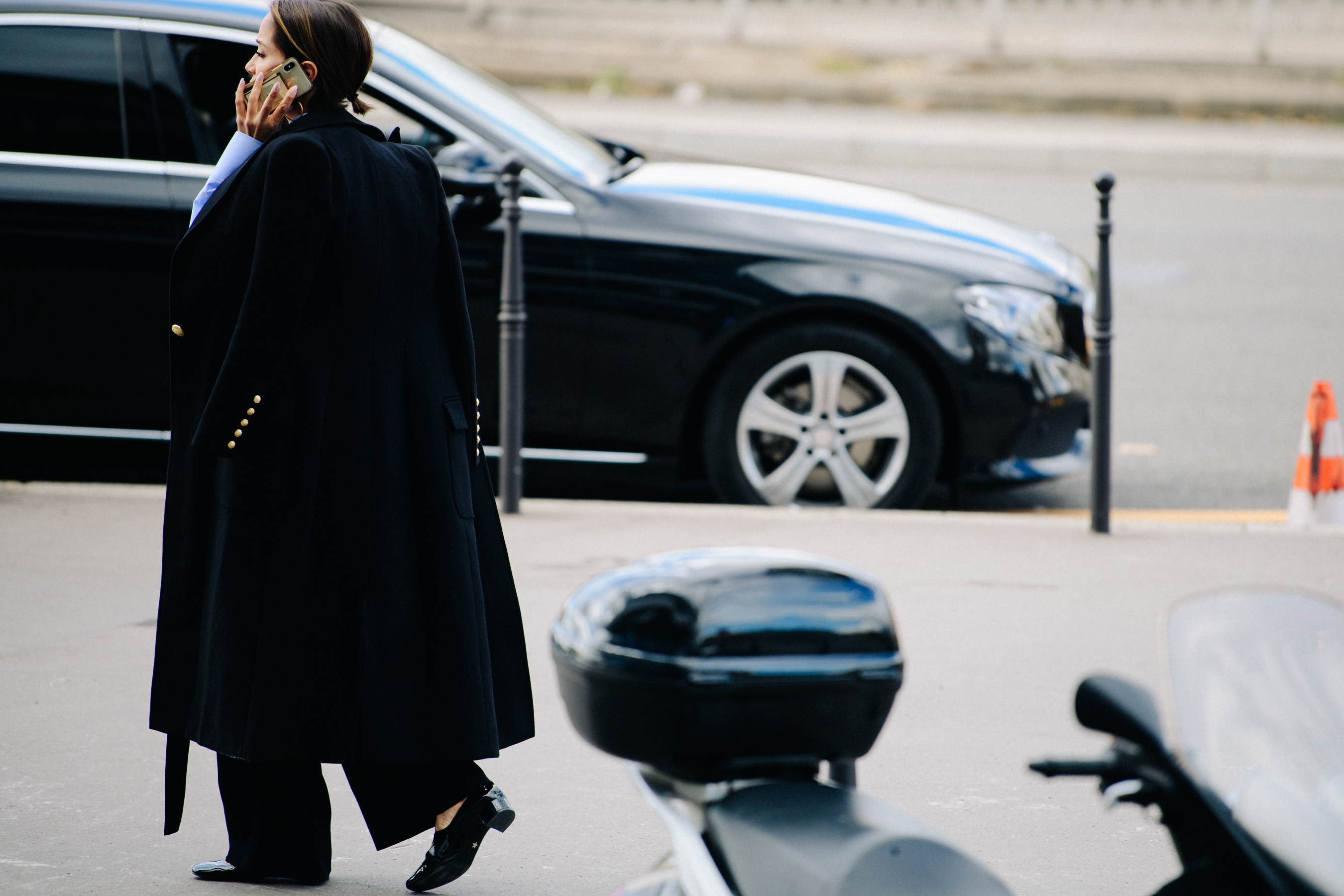 Woman wearing long black coat