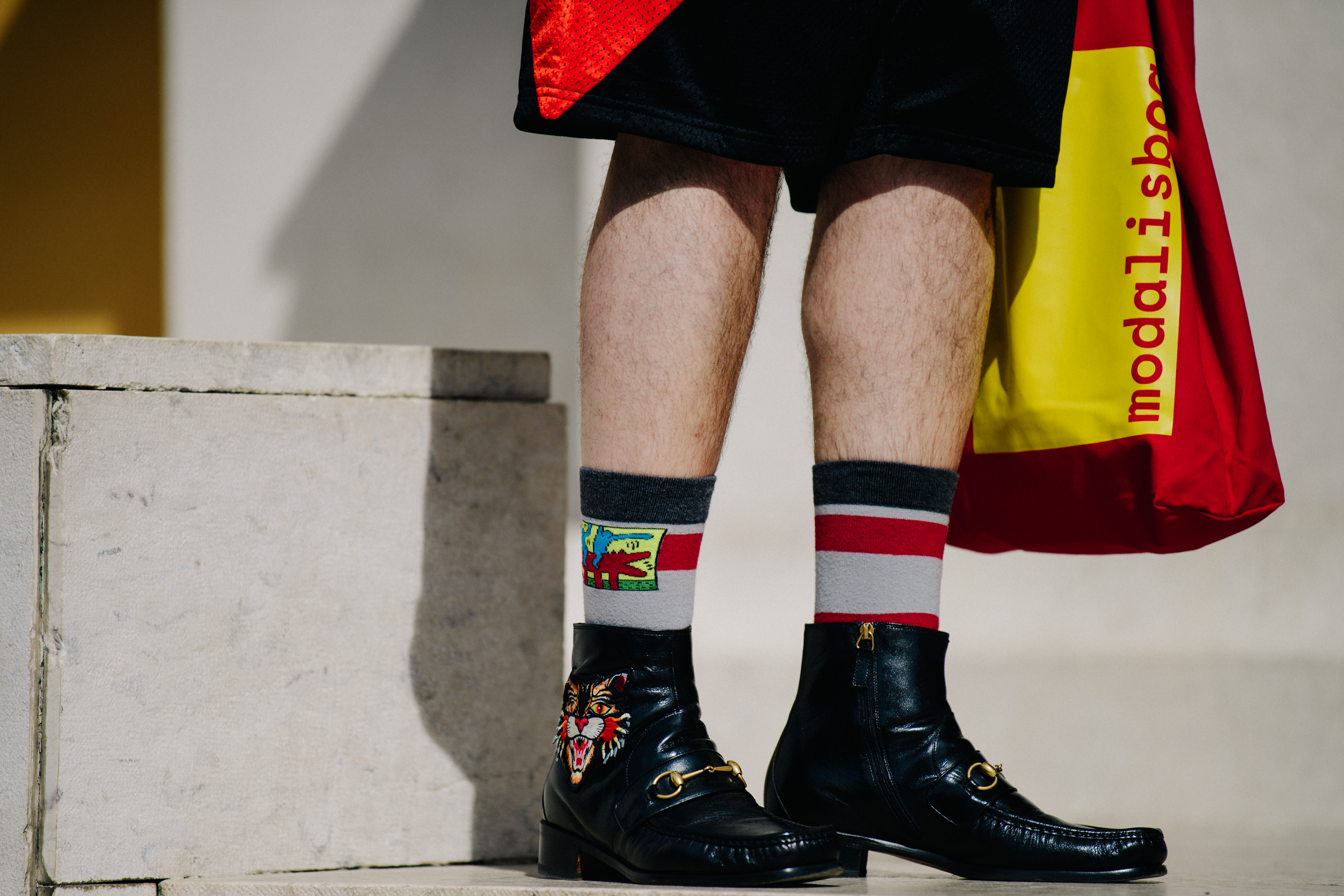 Man wearing Gucci boots