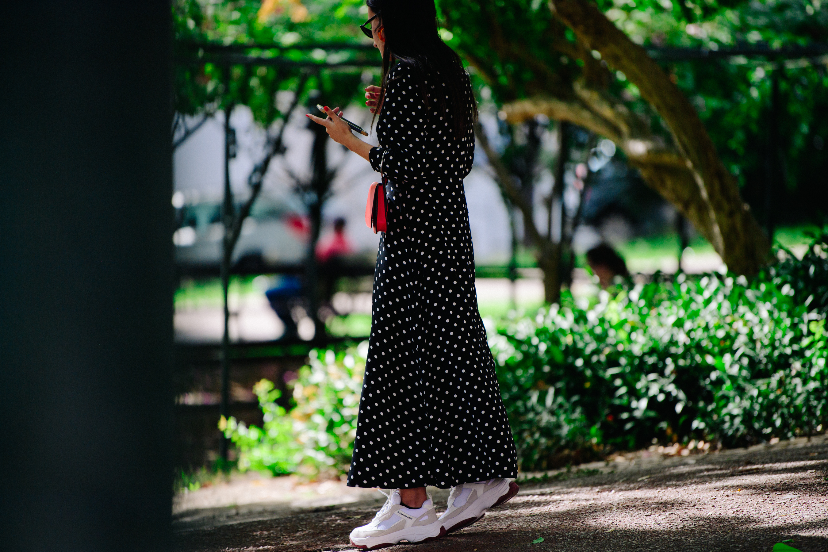 Woman wearing long spotted dress