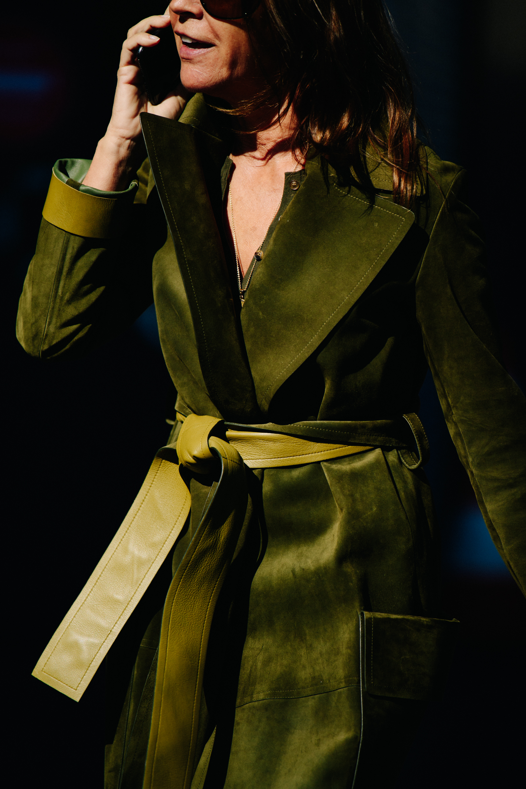Editor wearing green coat