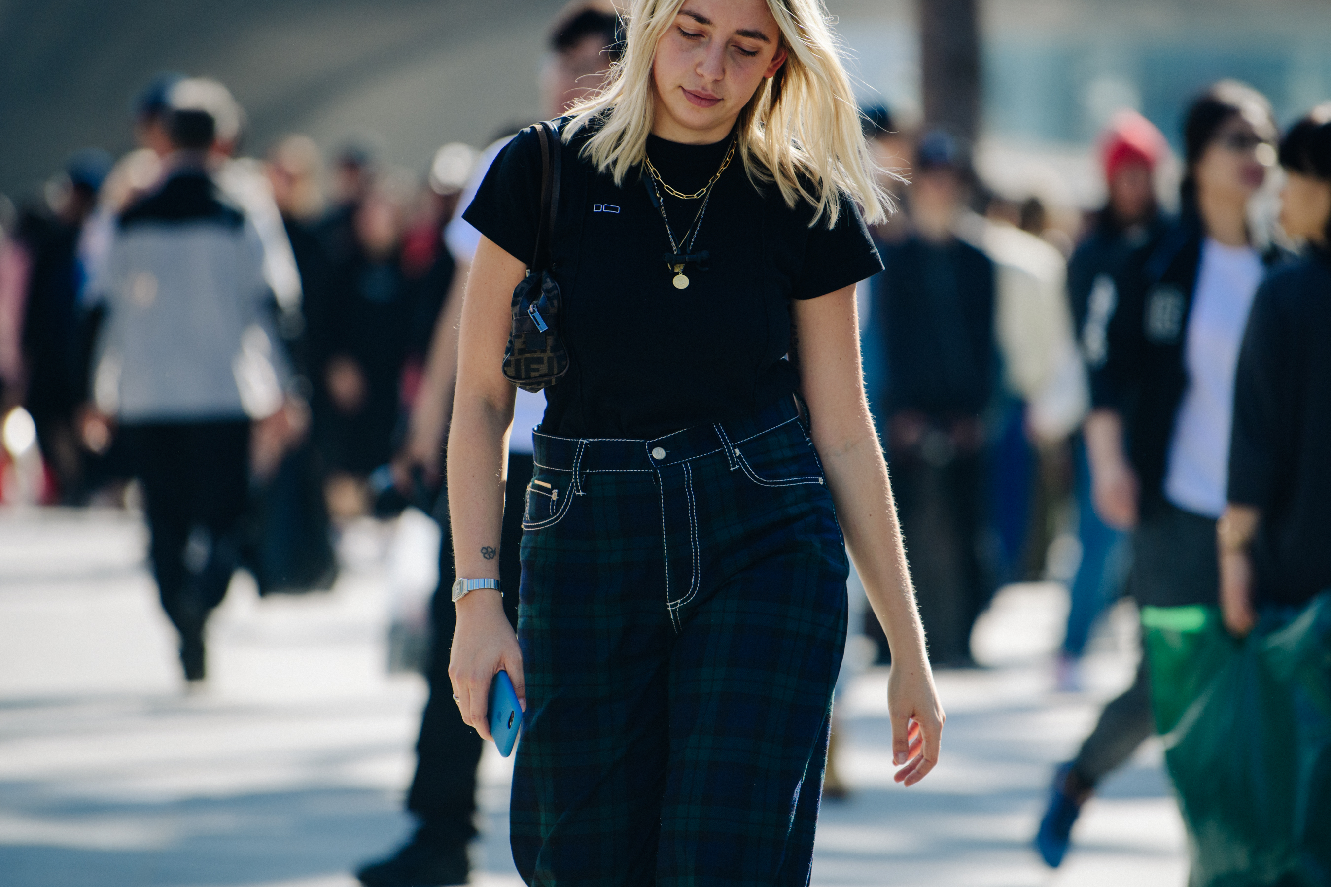 Woman wearing dark check pants