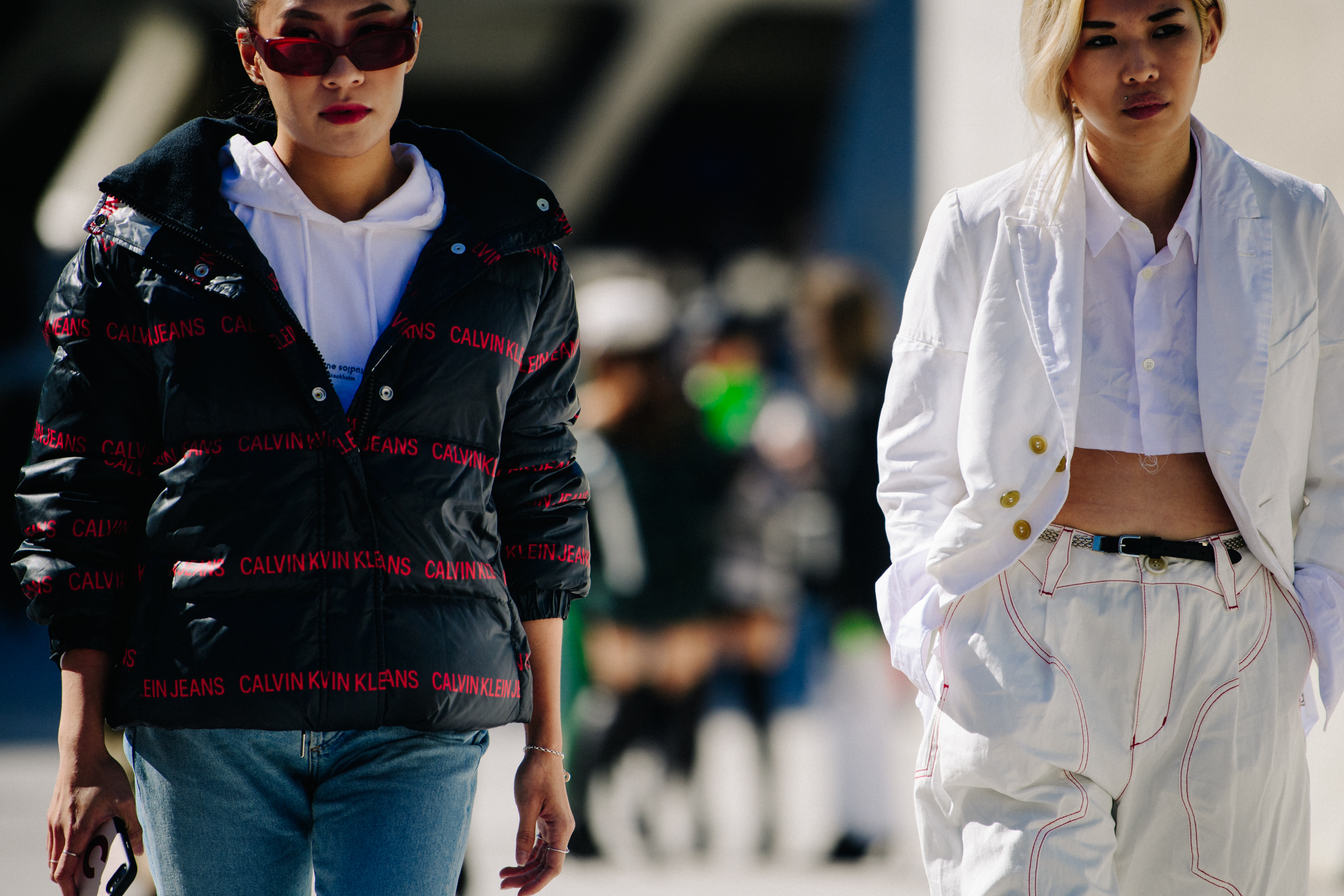 Two women wearing white and black
