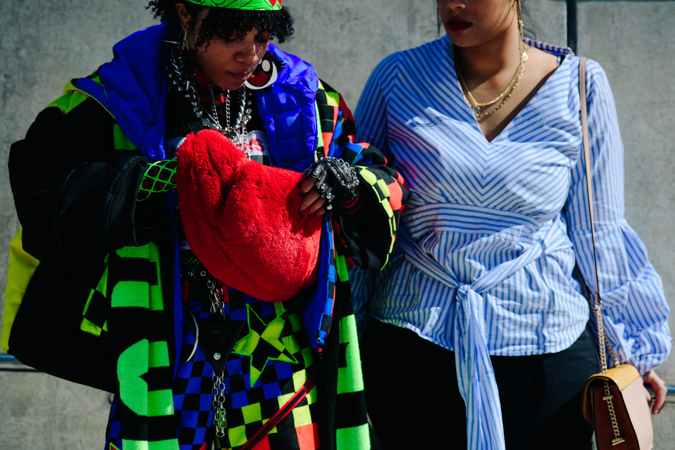 Two women wearing stripes and pattern