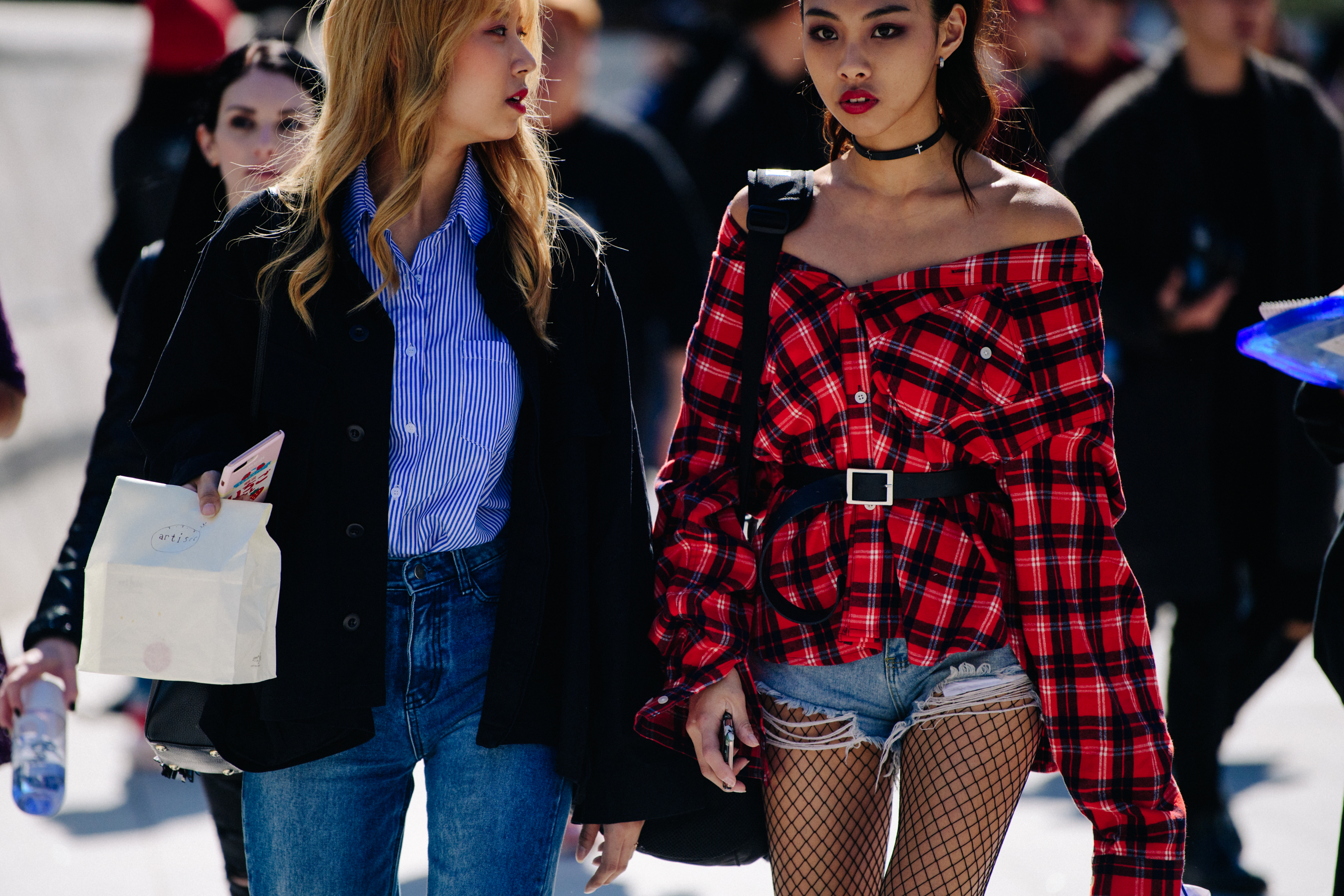Two women wearing red and blue
