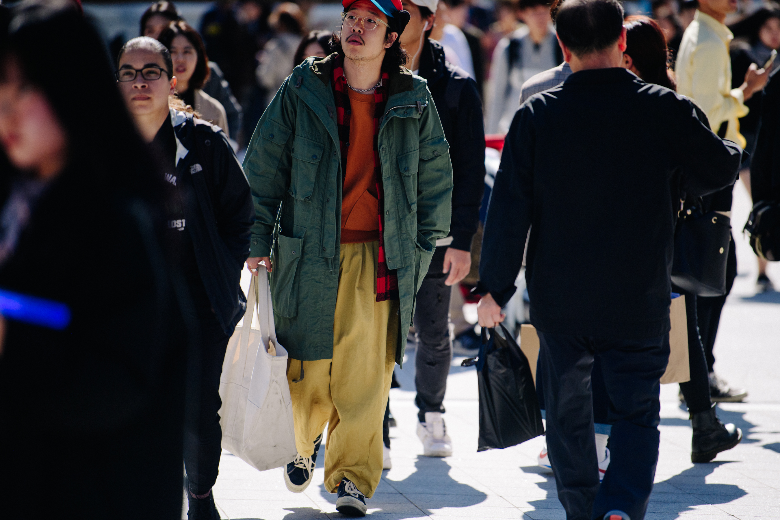 Man wearing long green coat