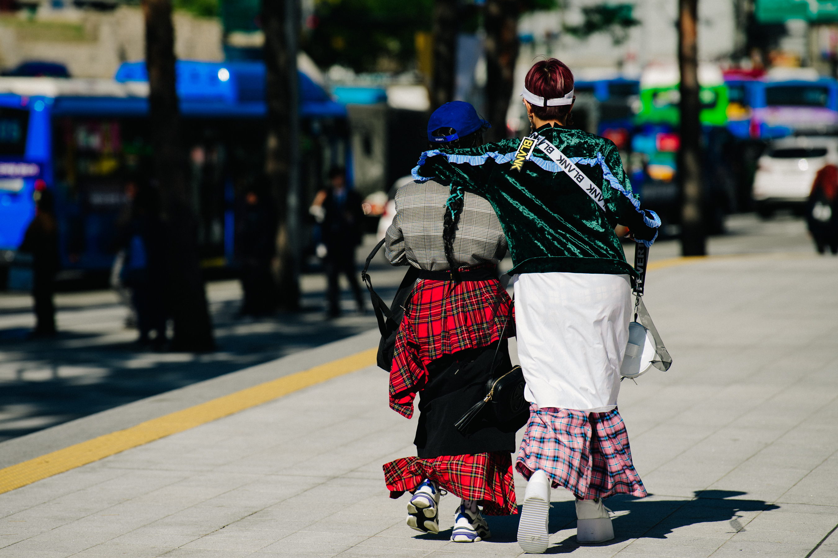 Two women wearing colourful outfits