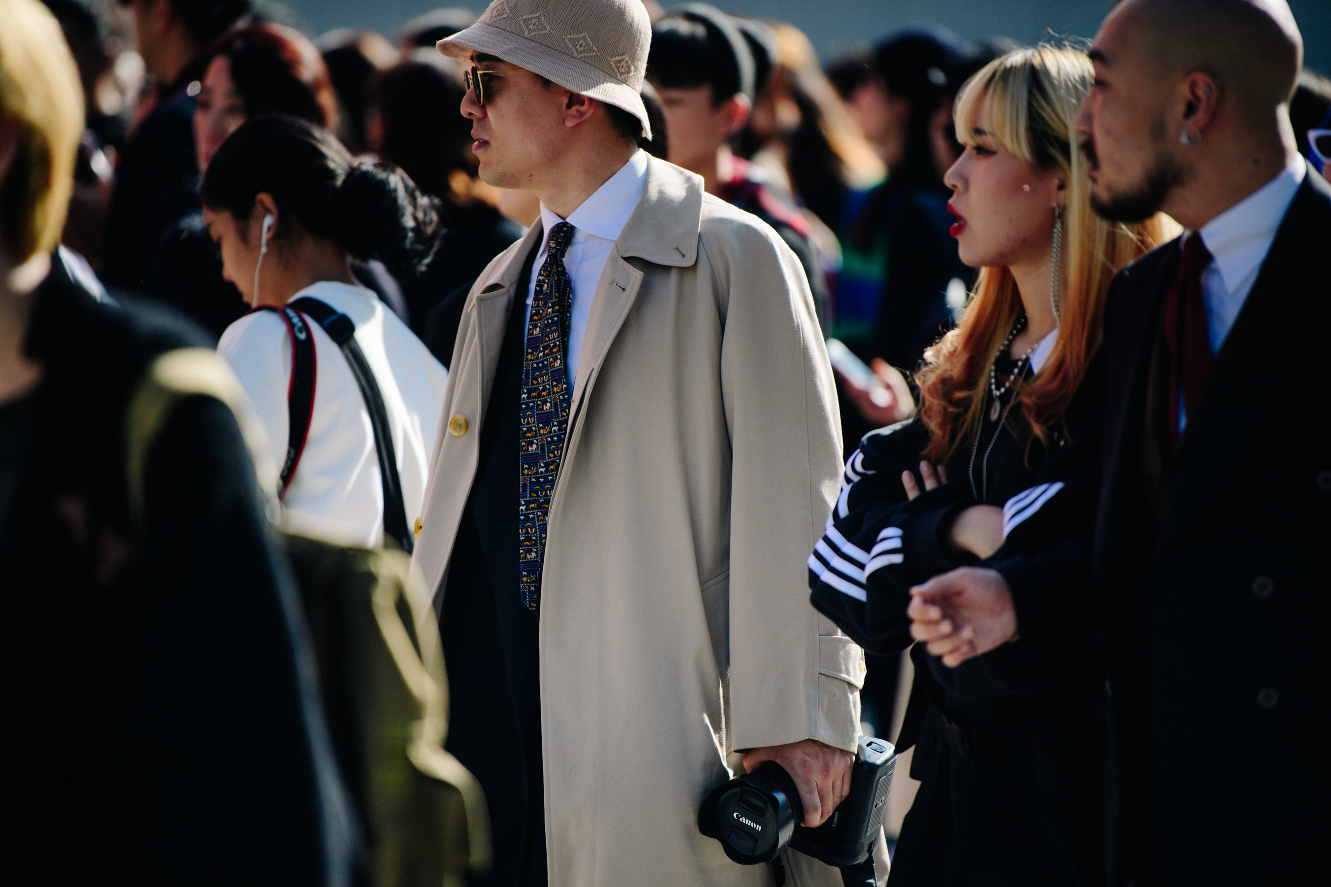 Man wearing long tan coat