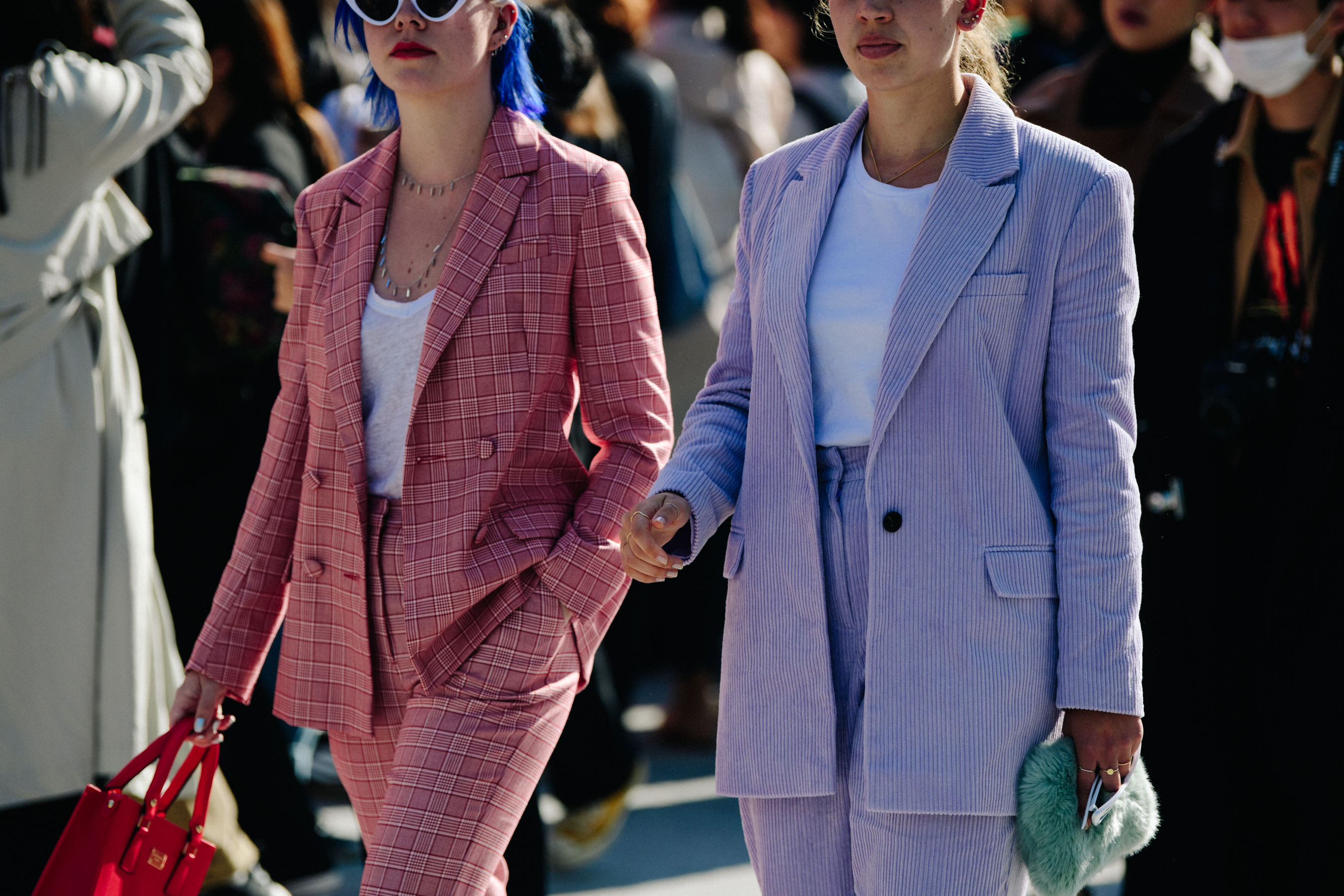 Two women wearing light colour jackets
