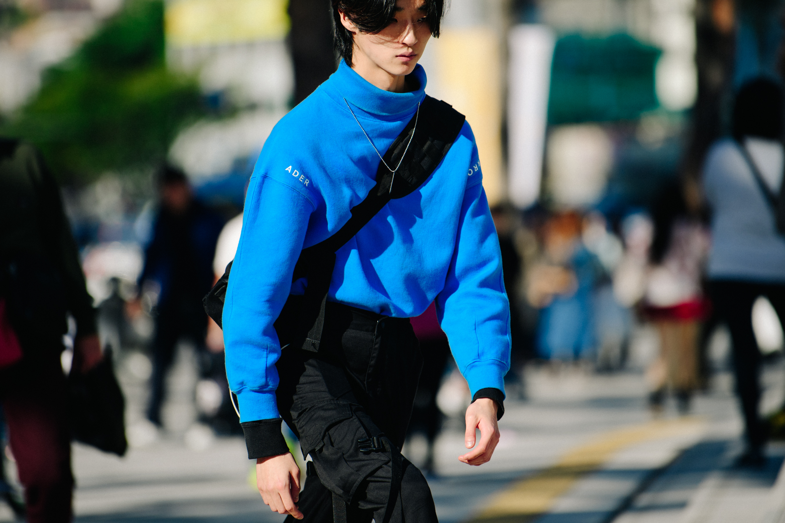 Man wearing blue jumper