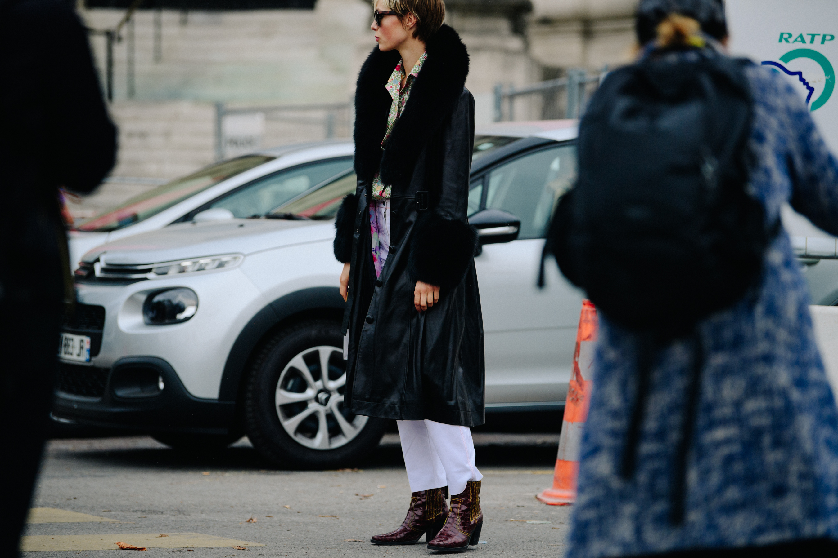 British model wearing long black coat