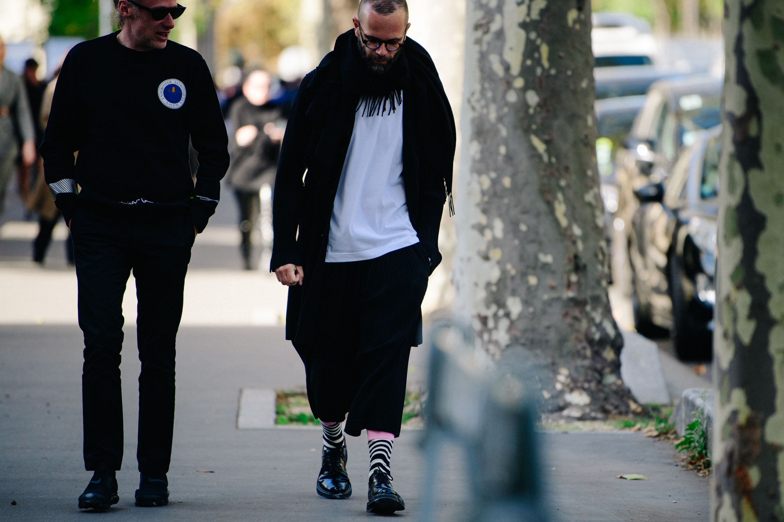 Two men wearing black and white