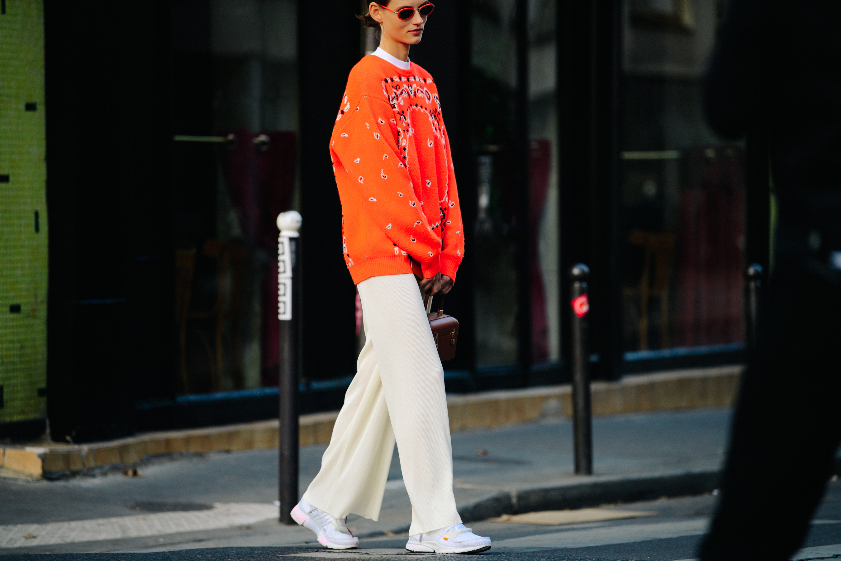 Model wearing orange jumper