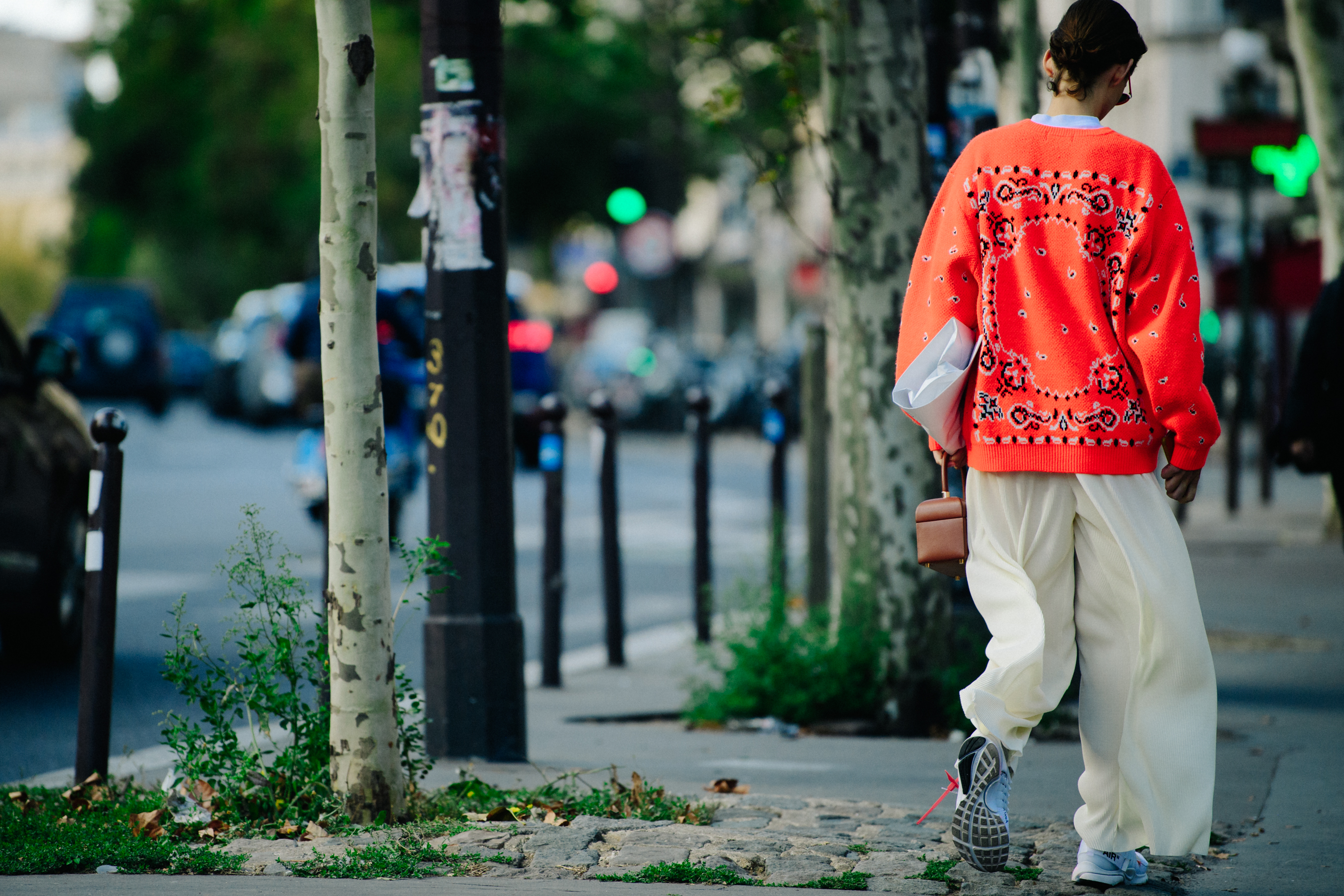 Model wearing orange jumper