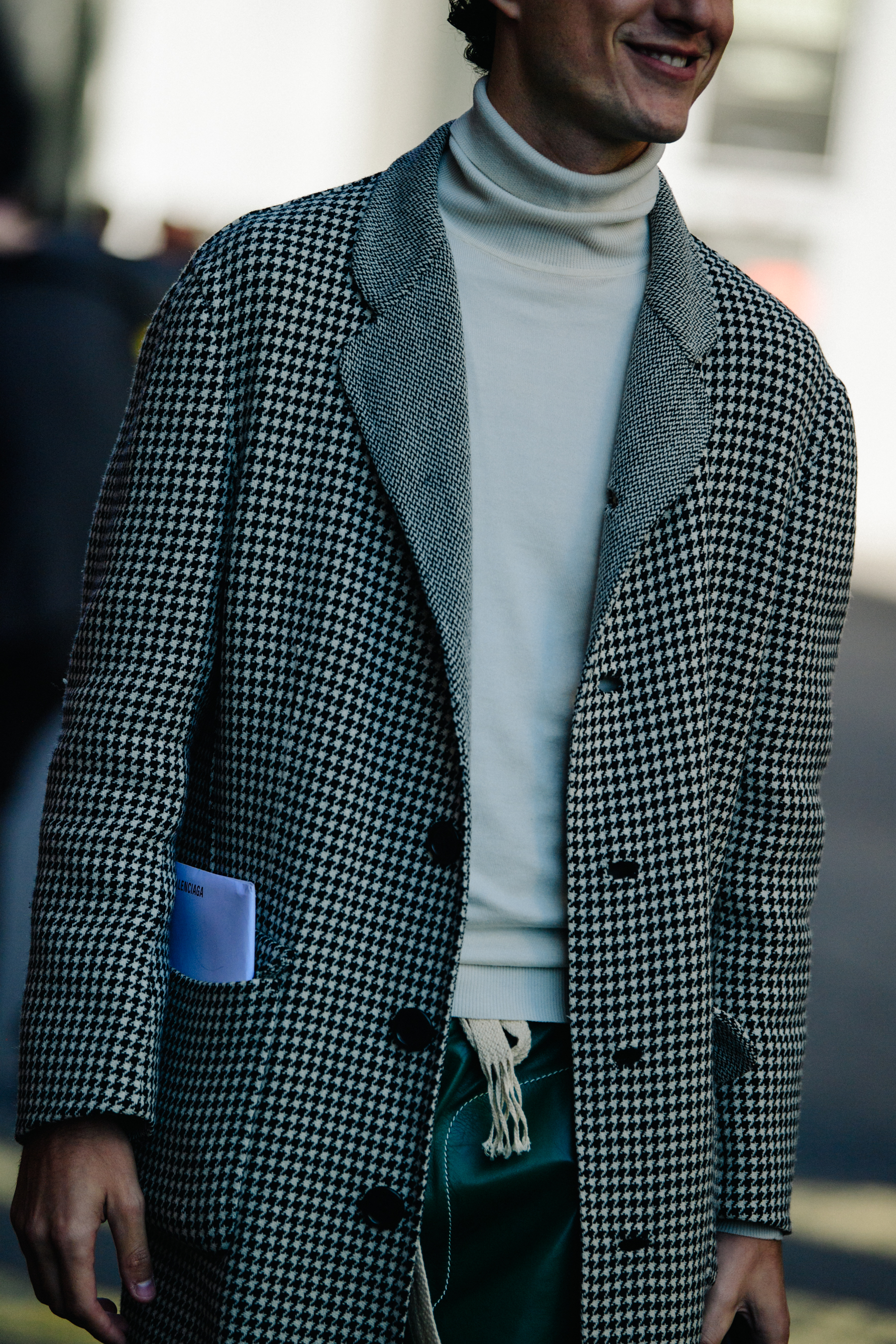 Man wearing light check coat