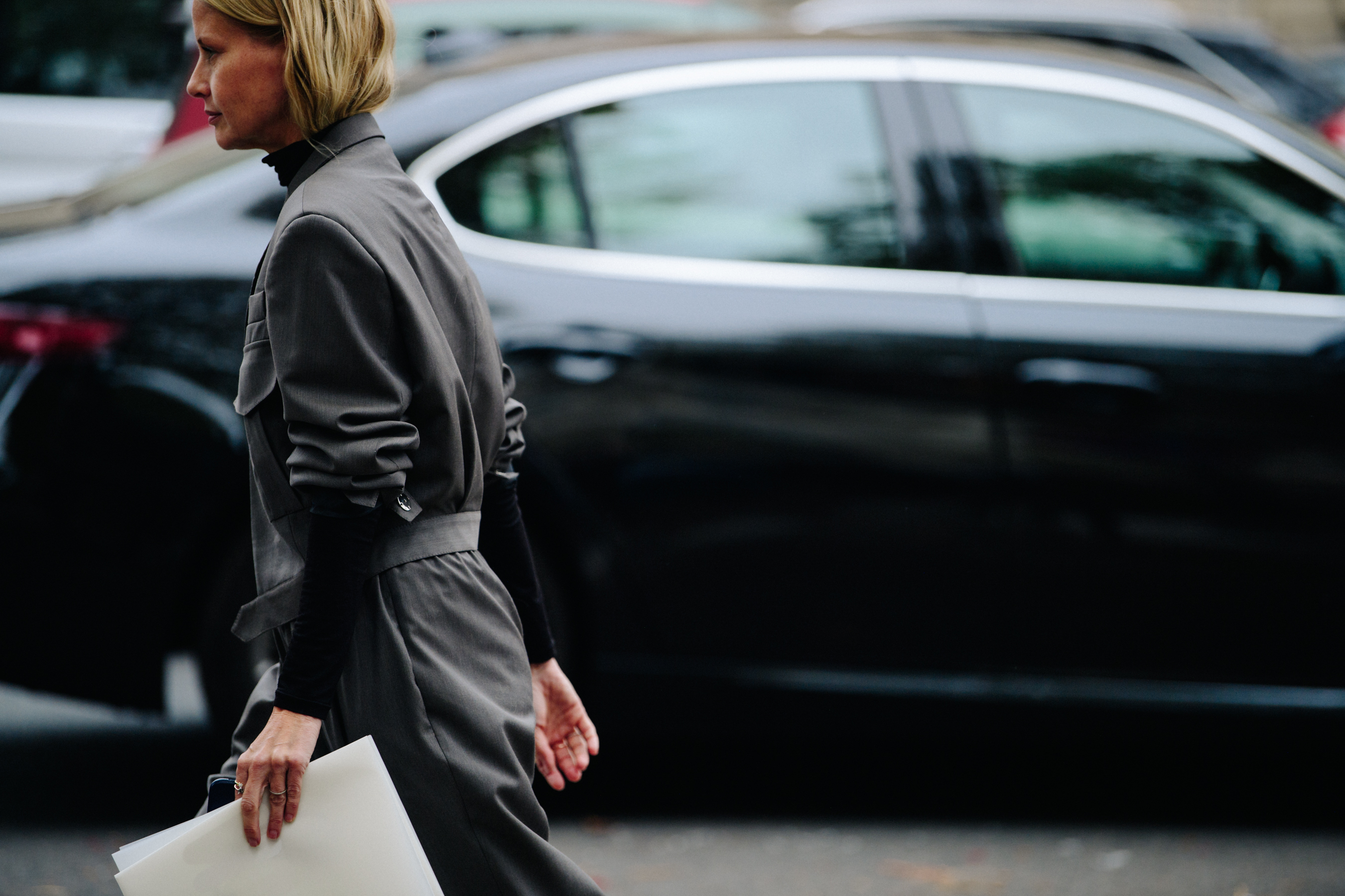 Woman wearing dark grey outfit