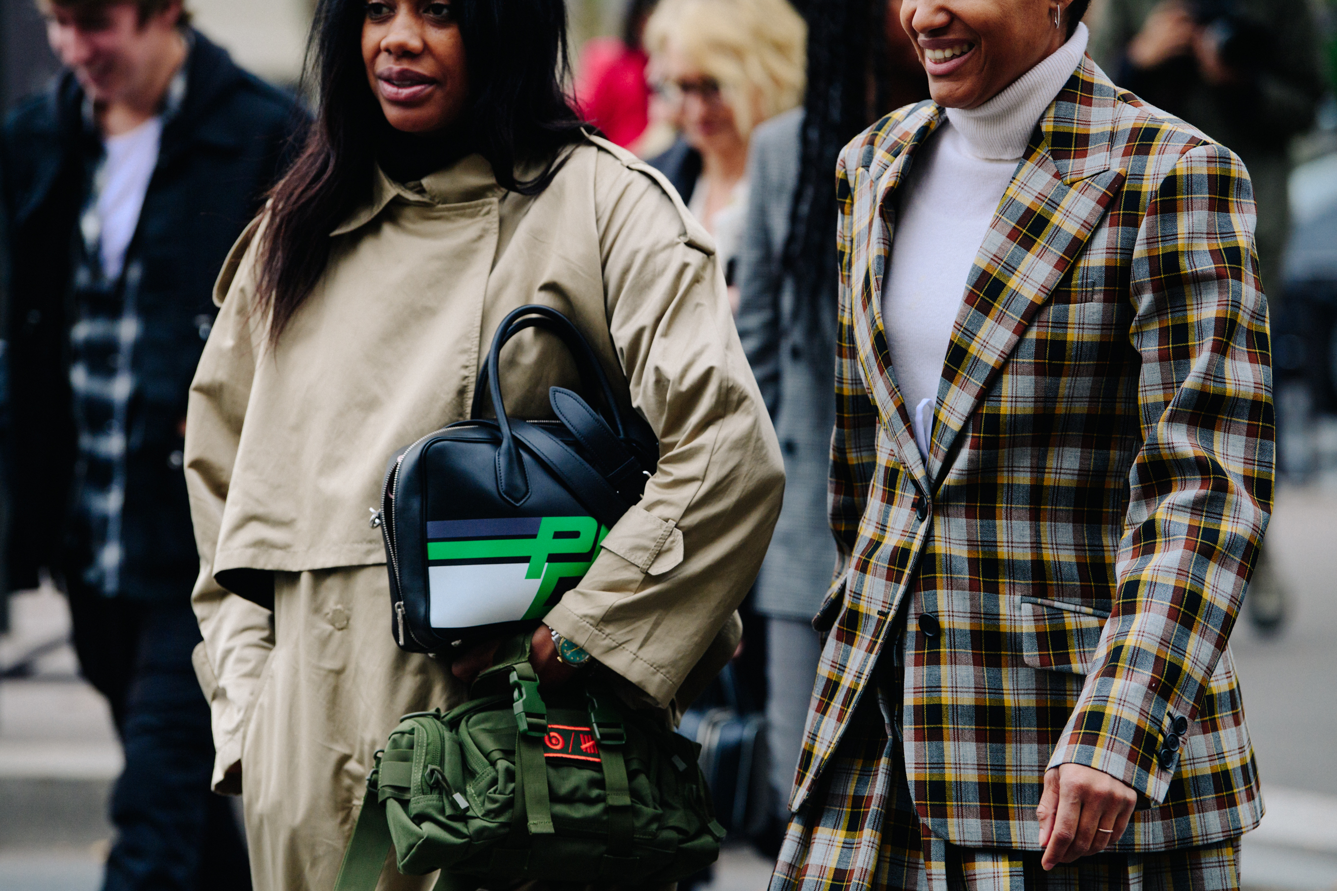 Two women wearing stylish outfits