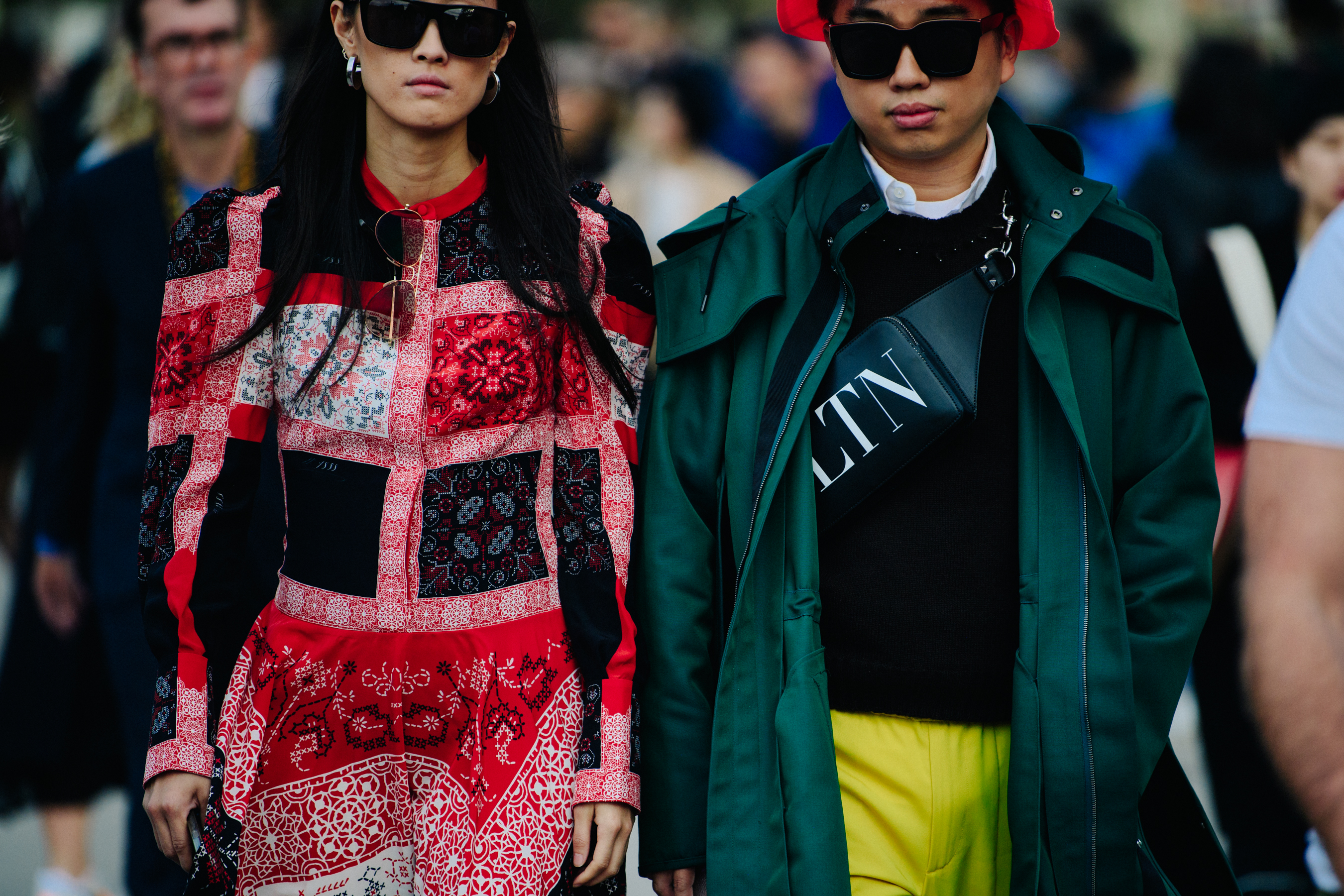 Asian couple wearing bright colours