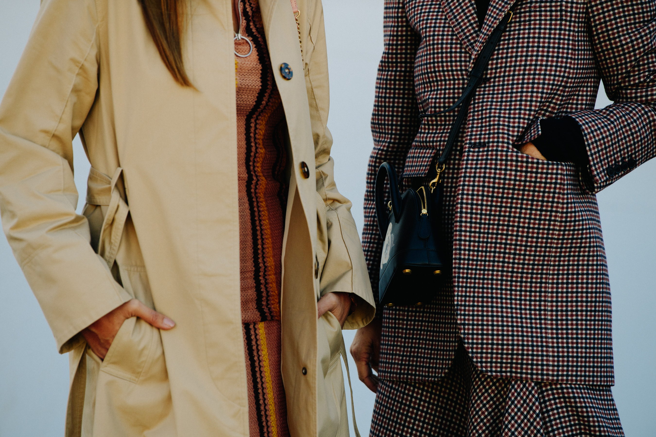 Two women wearing winter coats