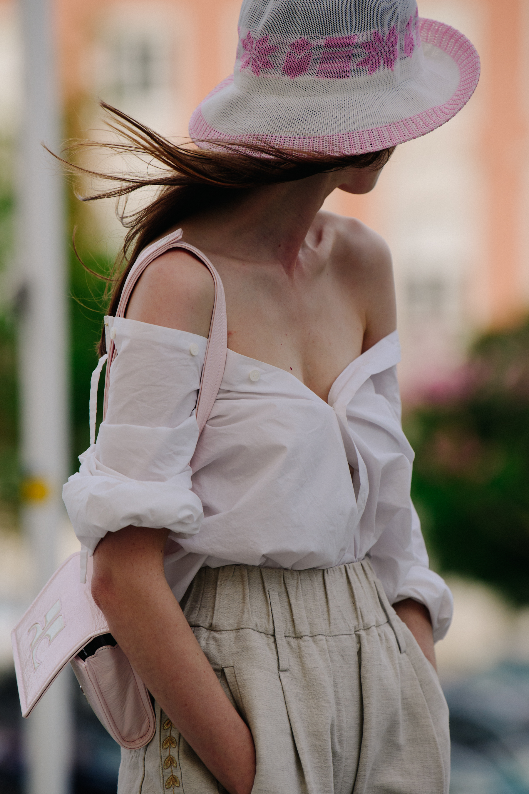 Woman wearing light pink hat
