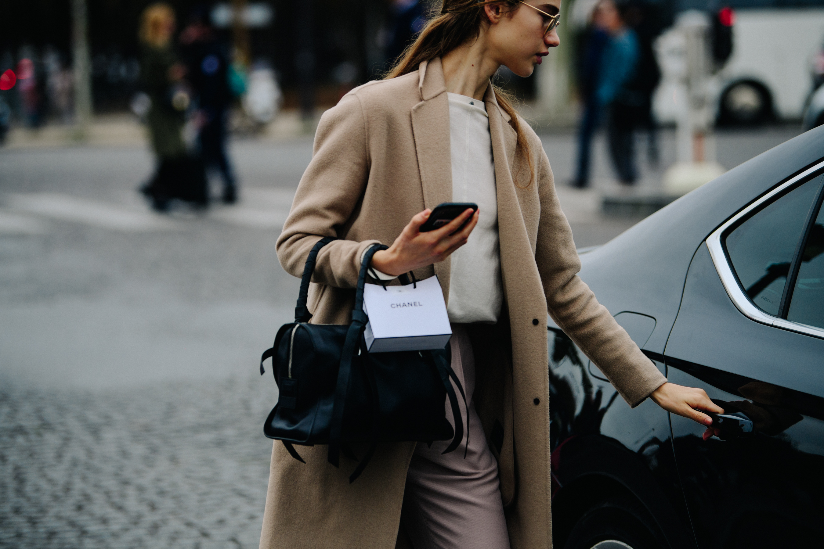 Model wearing tan coat