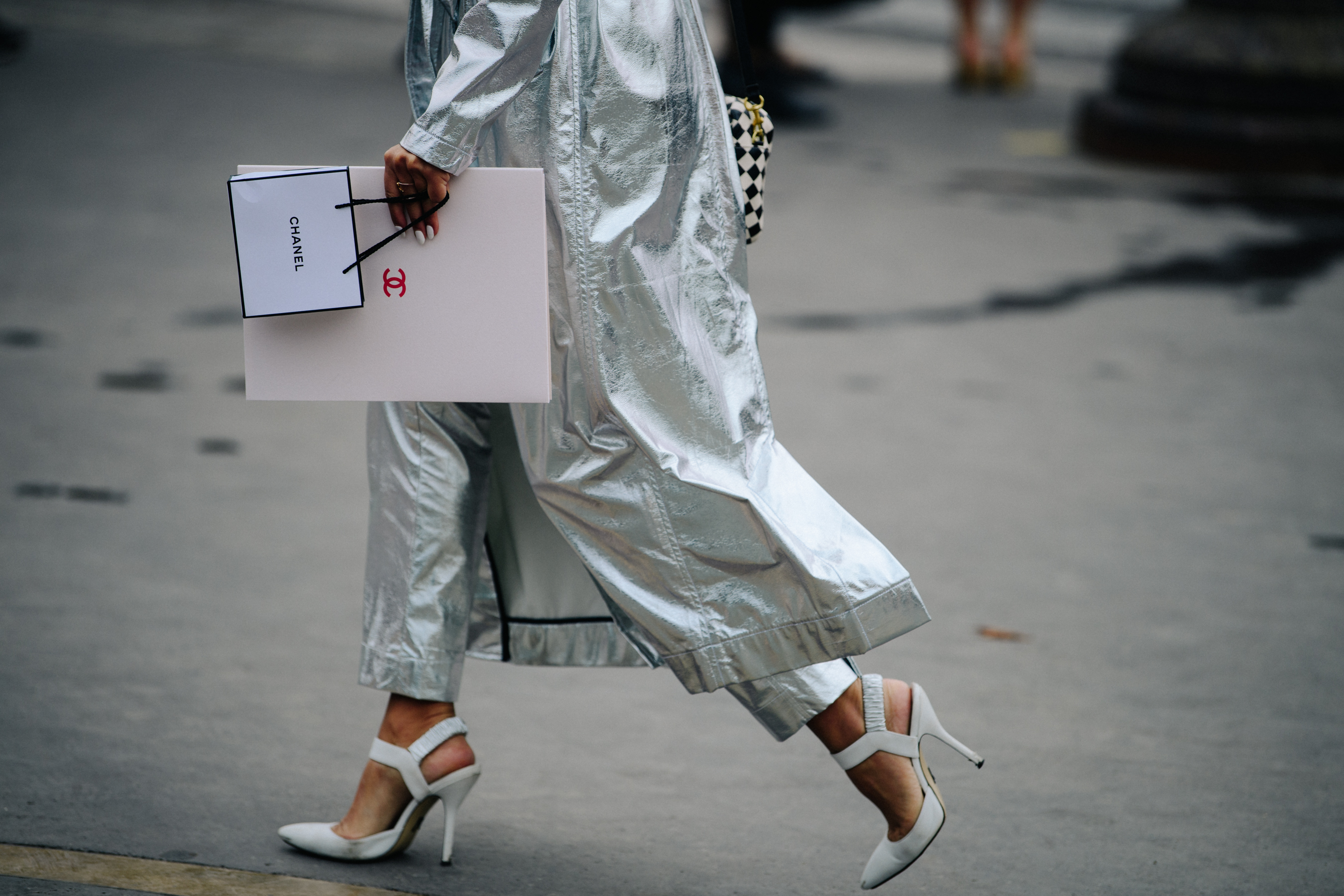 Woman wearing silver coat