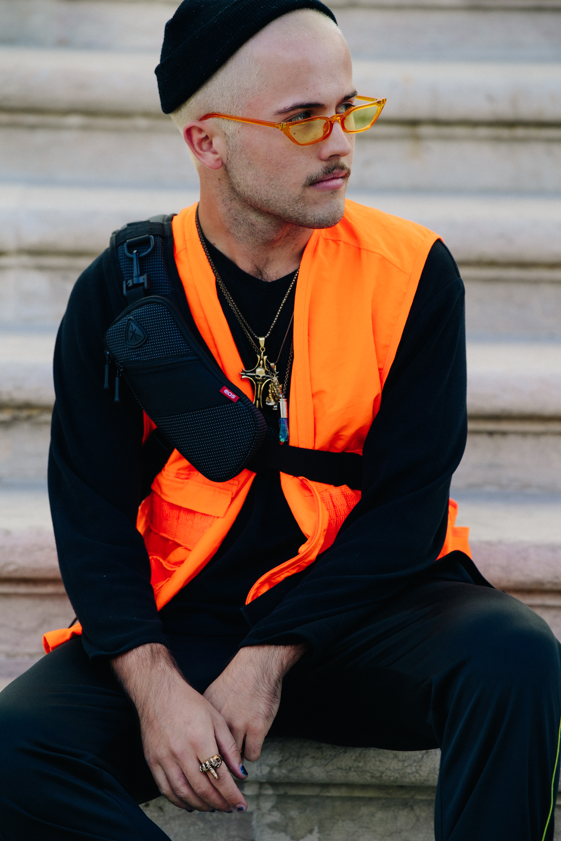 Man wearing orange vest