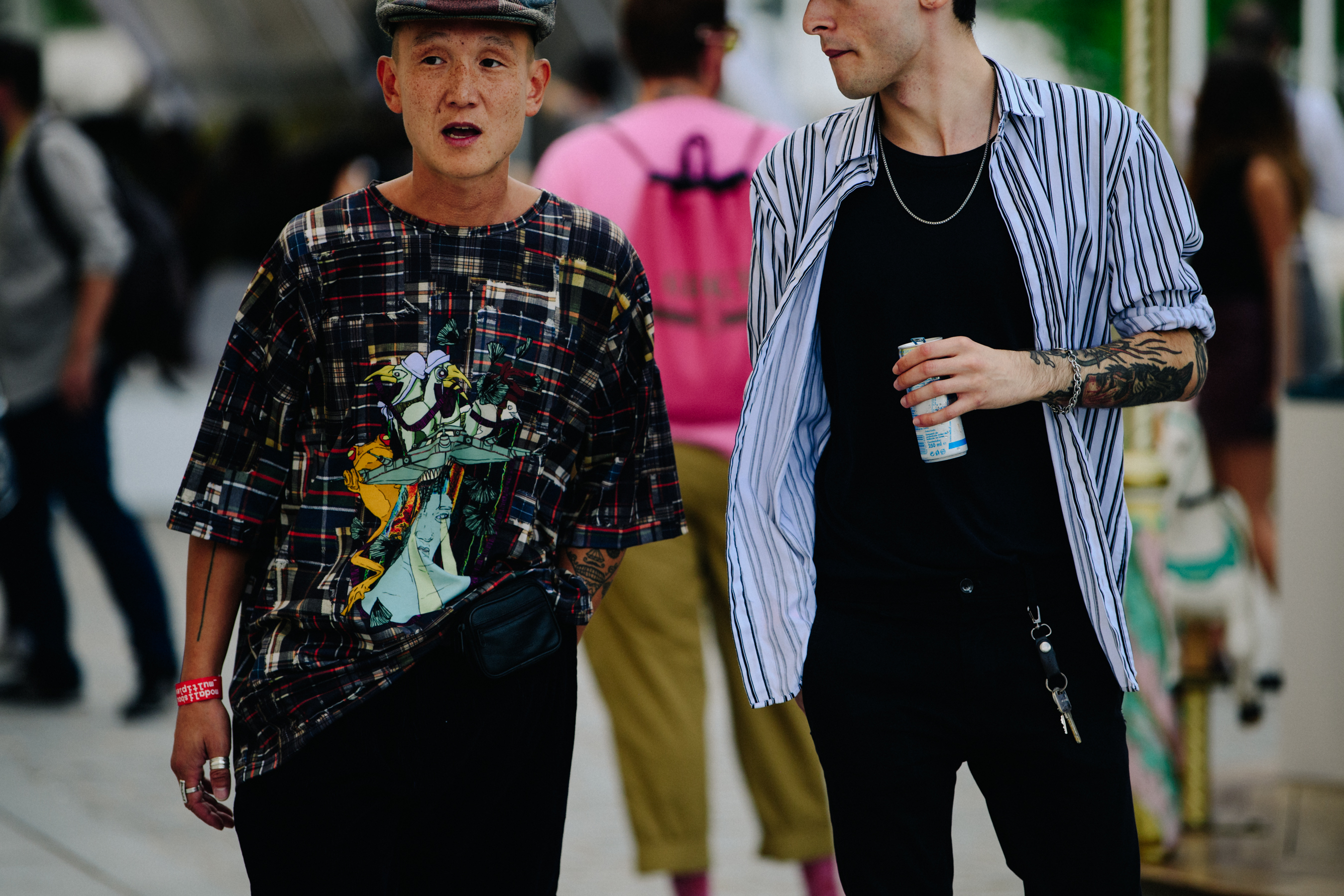 Two men wearing check and striped shirts